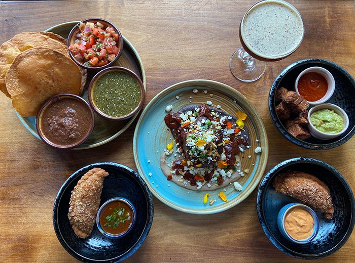 Puerta salsa trio, empanadas, chipotle short rib, pork belly chicharron and a cafe expres cocktail.