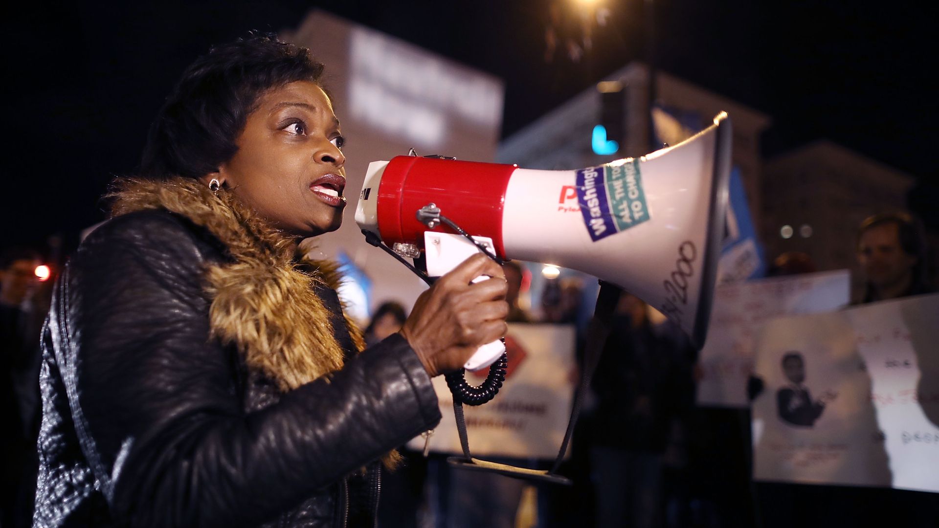 Mignon Clyburn speaks to protestors using a megaphone