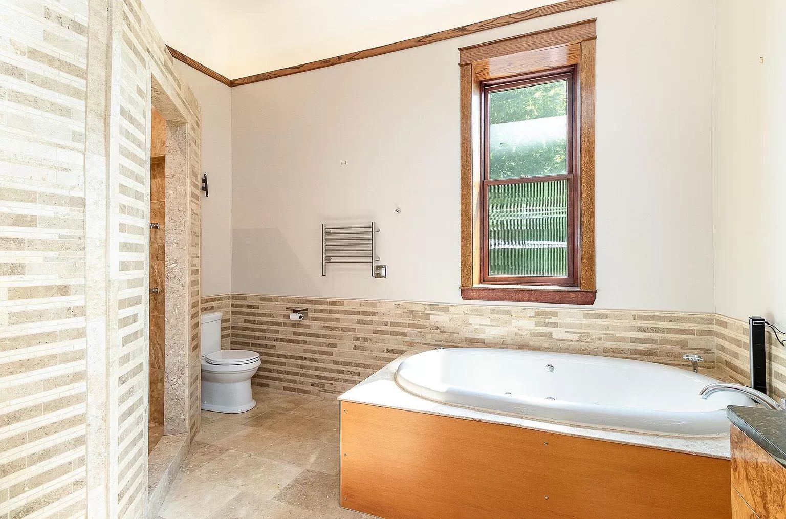 A bathroom with a large whirlpool tub.