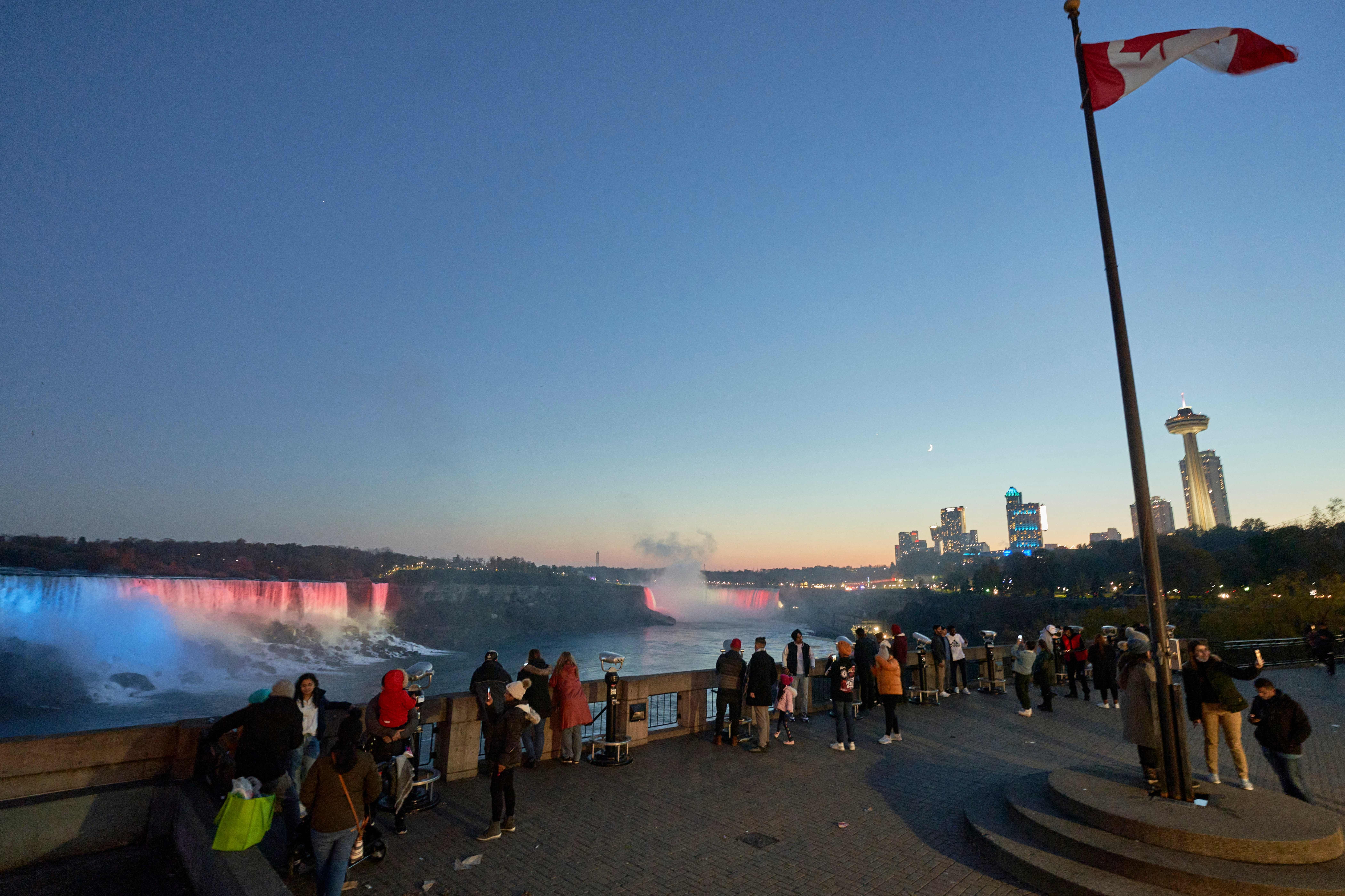 Tourists watch the sunset in Niagara Falls, Ontario, on November 7. 