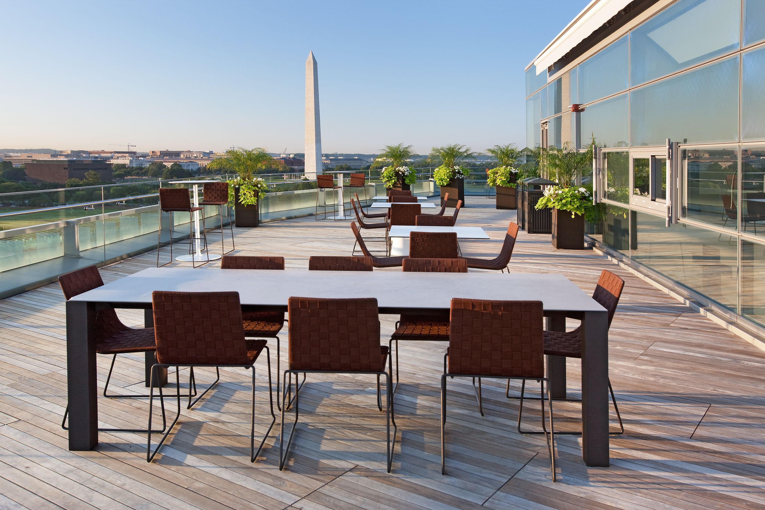 A rooftop terrace overlooking the Washington Monument