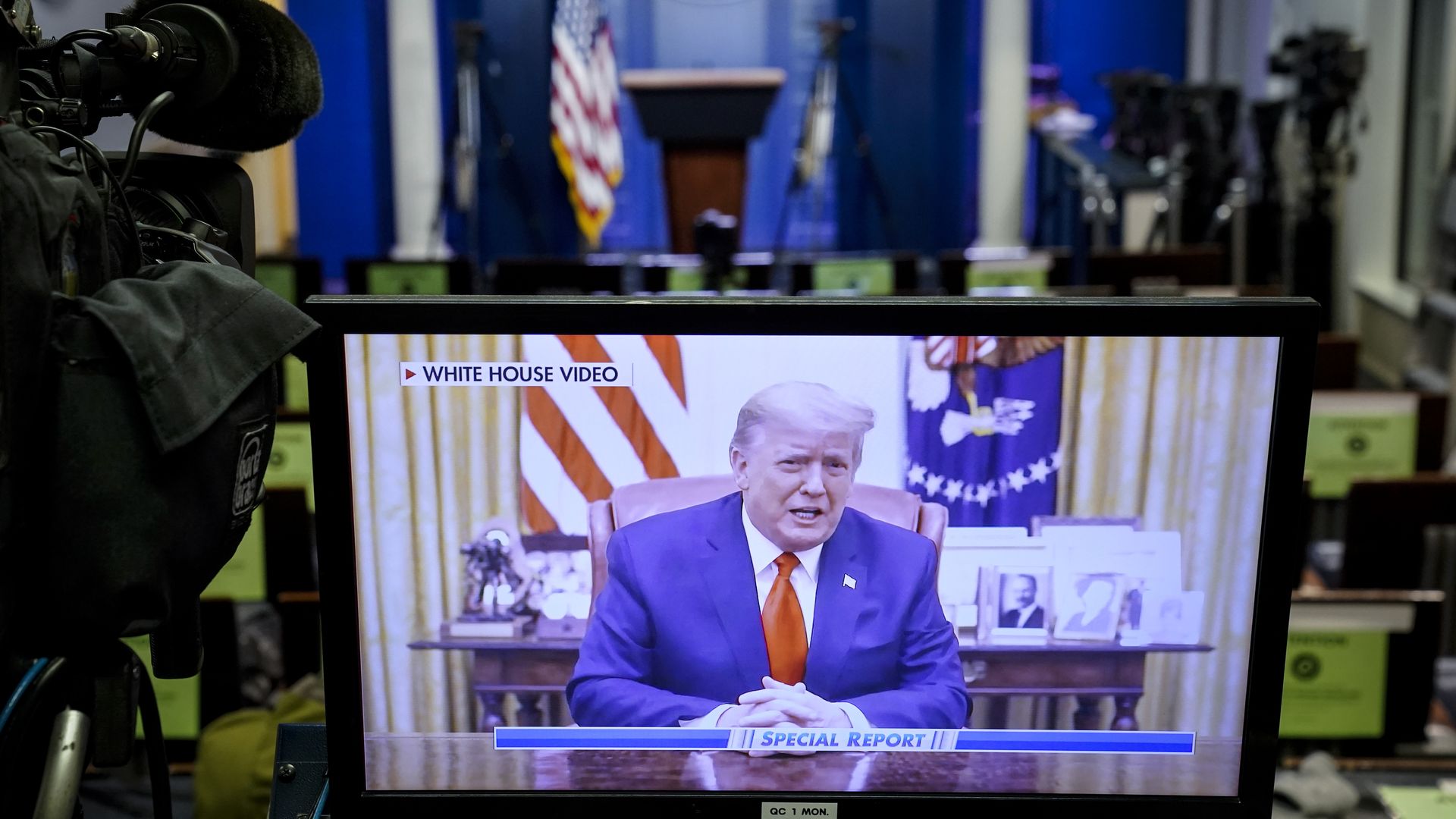 A television screen in a media room displays former President Trump in a blue suit and red tie speaking from the Oval Office, labeled "White House Video" with "Special Report" at the bottom.