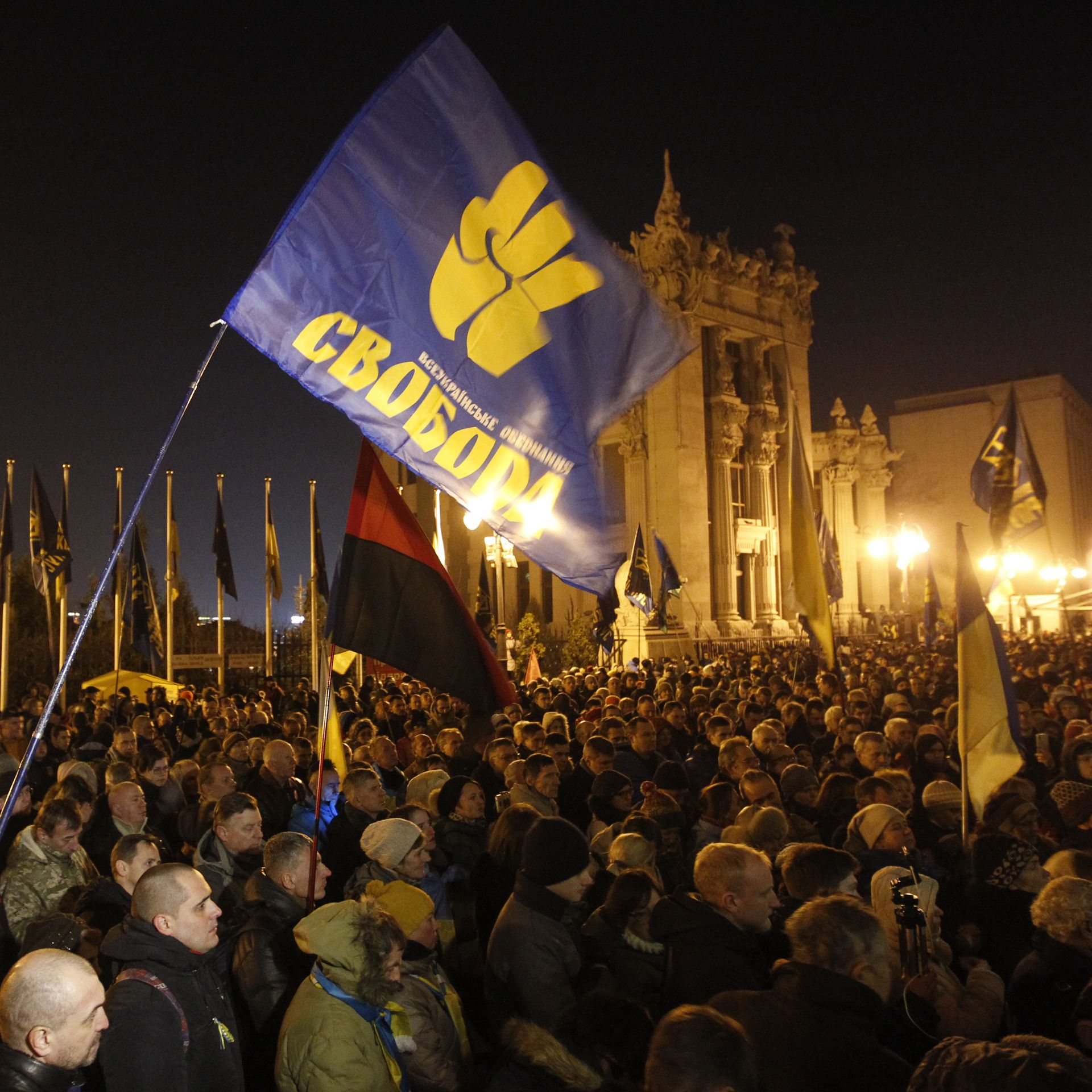 protestors at night in a public square in Kiev
