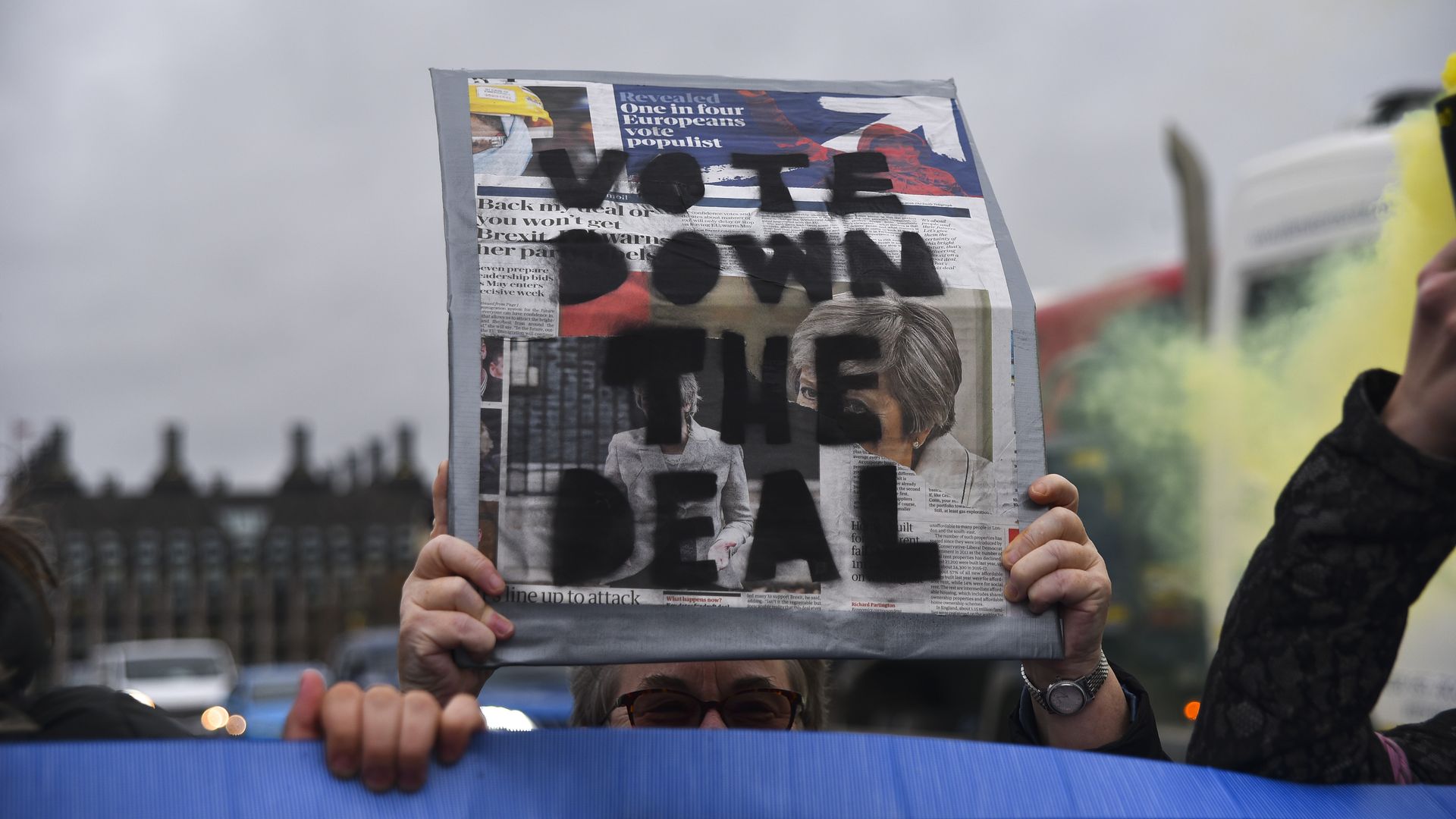  Anti Brexit demonstrators protest holding a banner reading 'Stop Building Borders' and wave flare as they block the traffic on Westminster Bridge