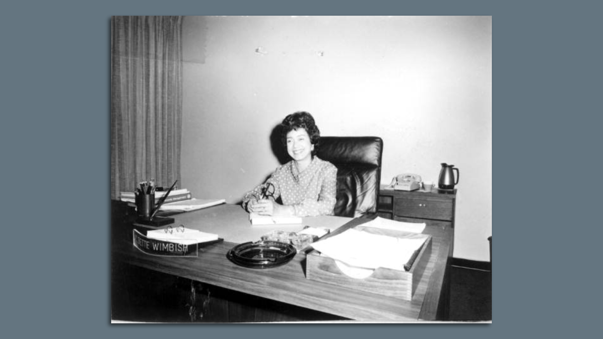 C. Bette Wimbish sits at a desk