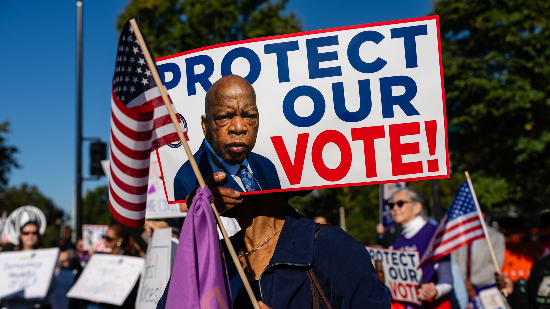 Demonstrators gather outside the Supreme Court in Washington, D.C., on Oct. 15, 2025, during argument about the Voting Rights Act. 