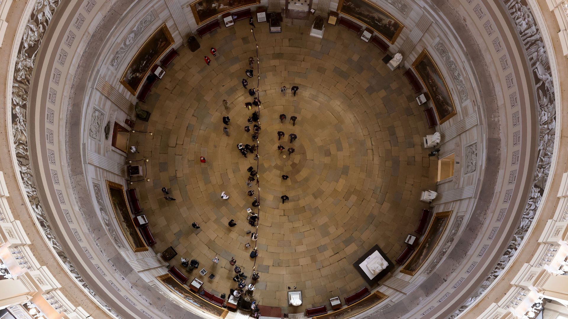 A photo from the top of the Capitol Rotunda showed House impeachment managers heading to the Senate for Donald Trump's second impeachment trial.