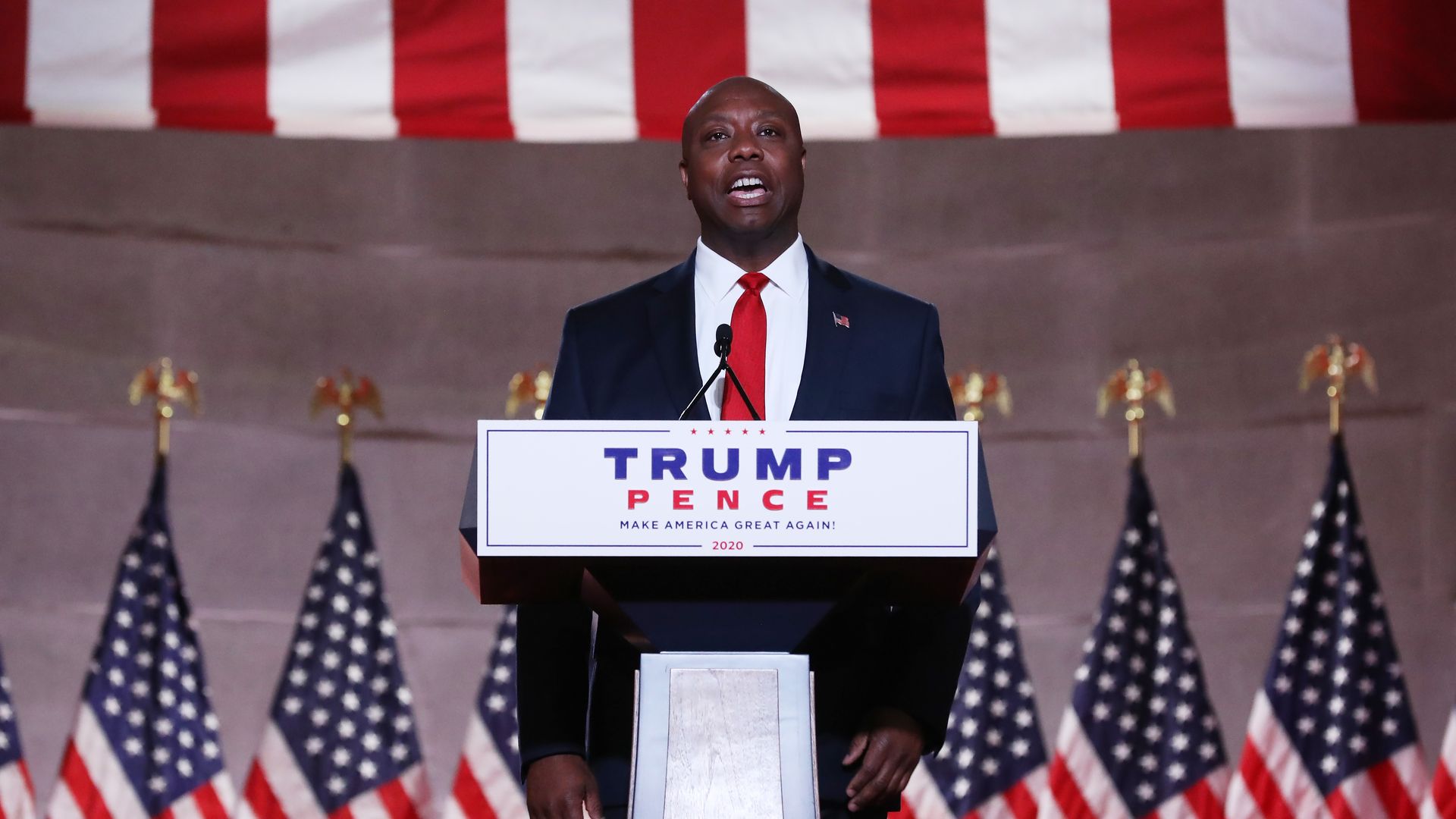 U.S. Sen. Tim Scott (R-SC) stands on stage in an empty Mellon Auditorium while addressing the Republican National Convention 