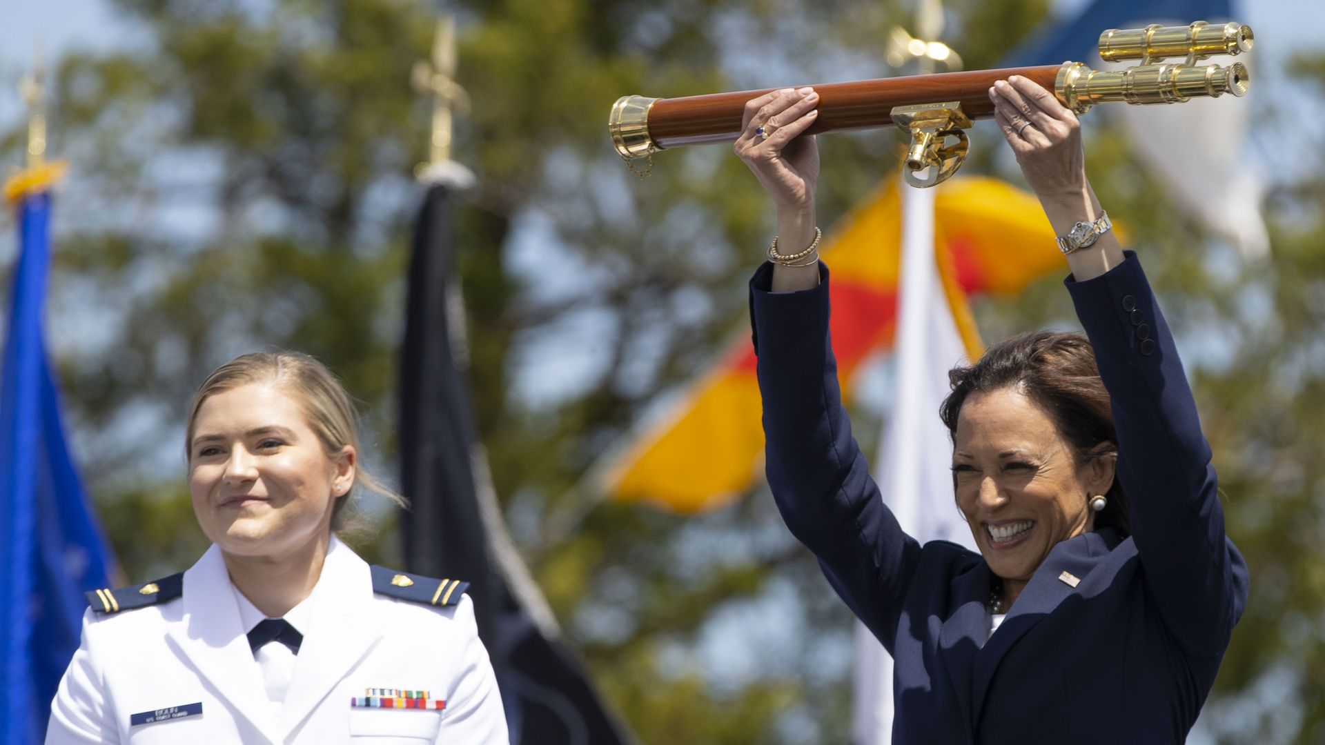 Vice President Kamala Harris is seen holding up a gift given to her as she addressed the Coast Guard Academy graduation ceremony.