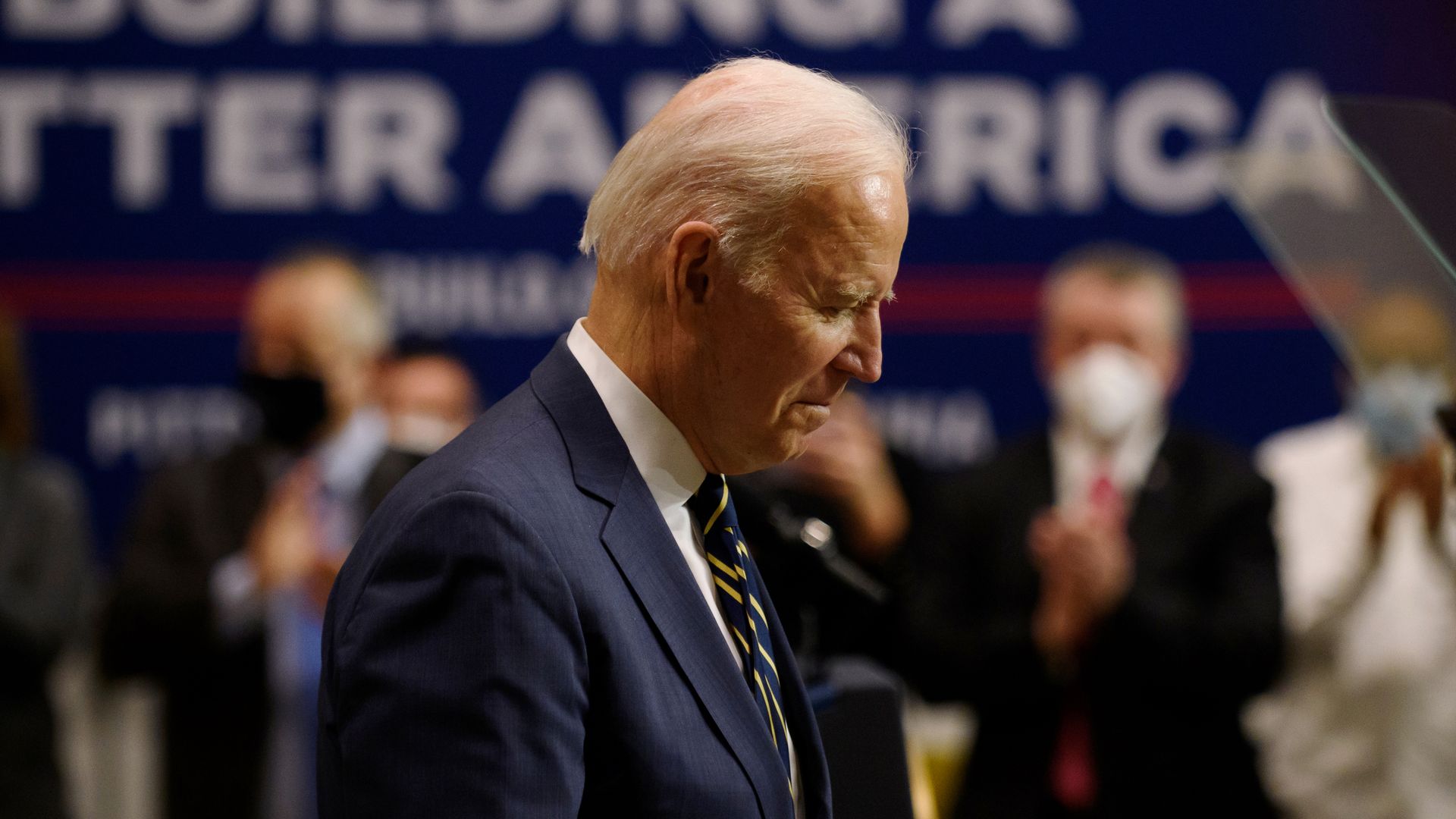 Photo of Joe Biden's side profile as he looks down 