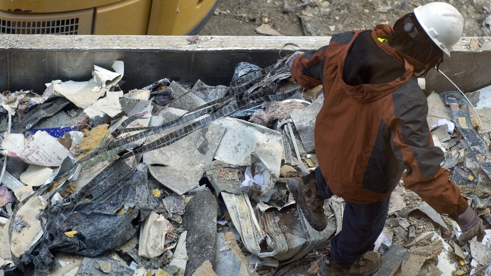 Worker going through a dumpster in Washington