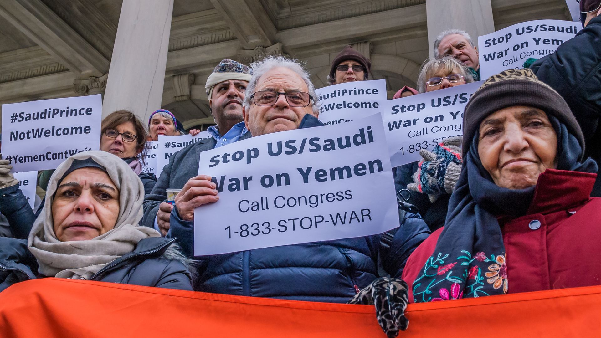 New Yorkers hold signs that say, "Stop U.S./Saudi War in Yemen"