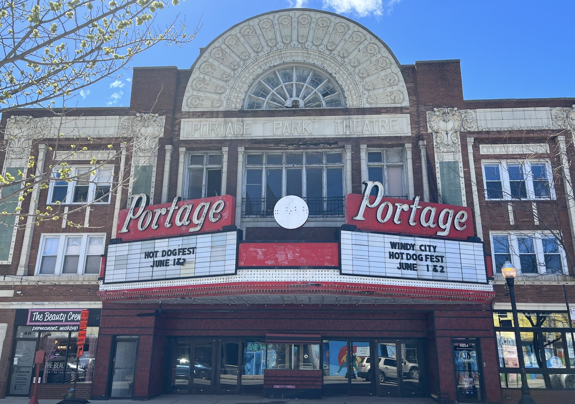 Theater with two marquees with the word Portage on a red background.
