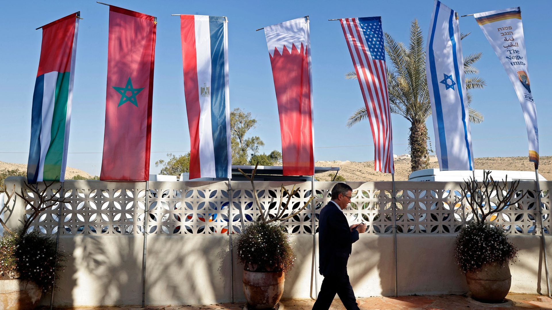 Flags are set up during the Negev Summit in the southern Negev desert on March 28, 2022. Photo: Jack Guez/AFP via Getty Images