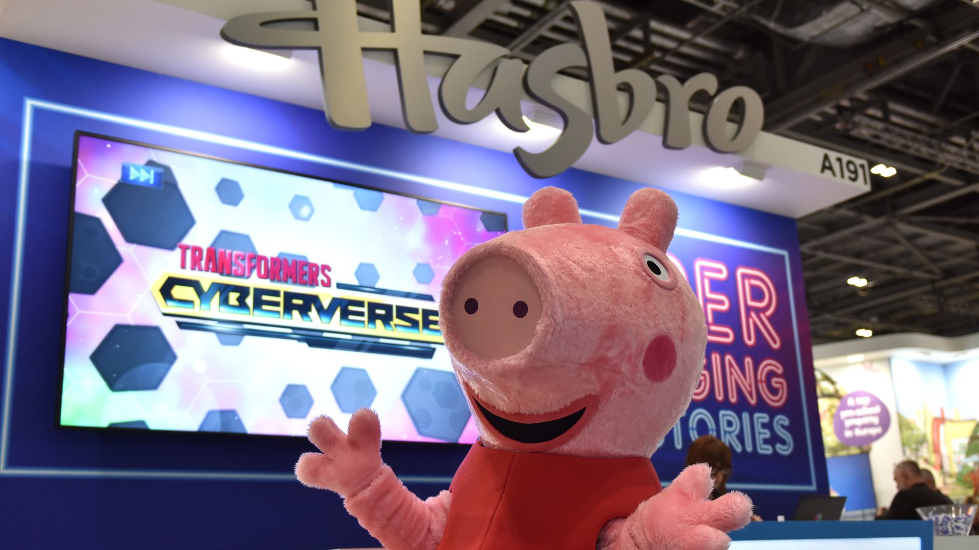 A Peppa Pig character poses under the Hasbro logo during Brand Licensing Europe at ExCel on November 18, 2021 in London, England. 
