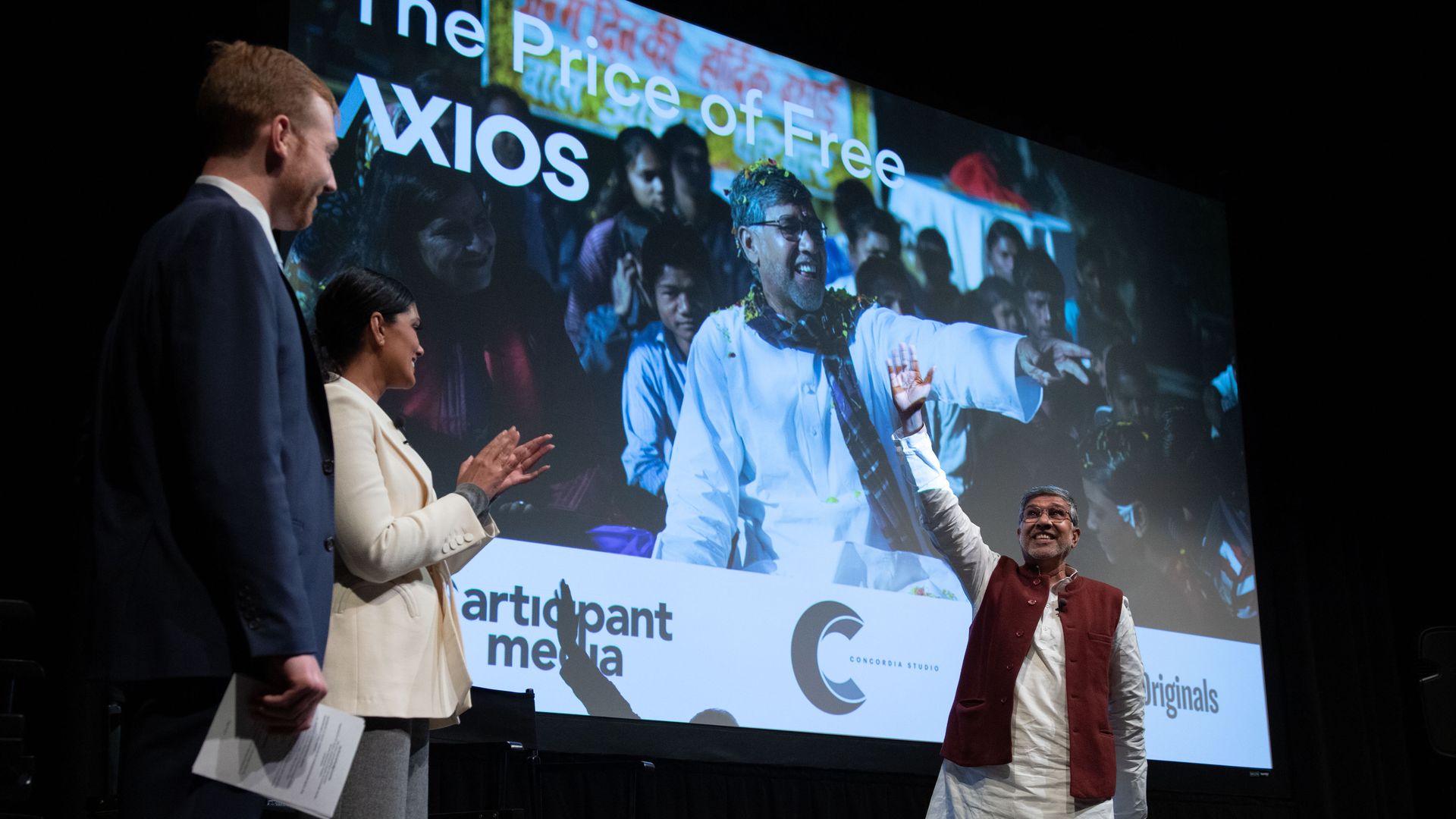 Kailash Satyarthi takes to the Axios stage waving to the crowd