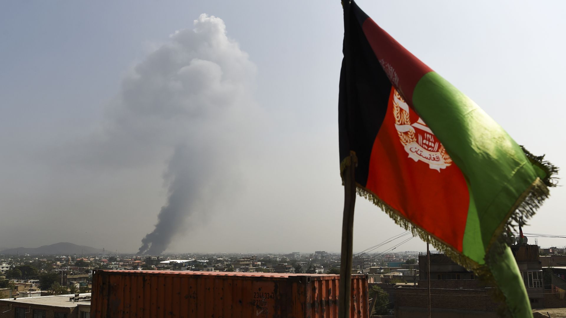Smoke rises from the site of an attack after a massive explosion the night before near the Green Village in Kabul on September 3