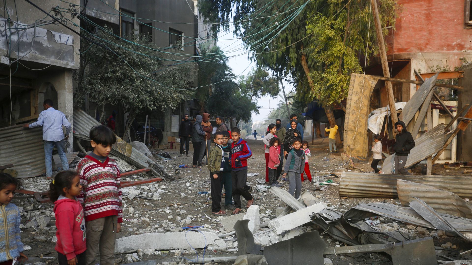 Palestinians visit the site of the attack to inspect the damage after an Israeli airstrike targeted a building belonging to the al-Habbash family in the Nuseirat Refugee Camp in central Gaza City, Gaza on December 12, 2024.. The attack resulted in casualties and injuries, with significant damage to 