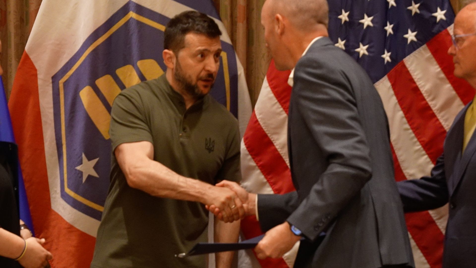 Ukraine President Zelenskyy shakes hands with Gov. Spencer Cox.