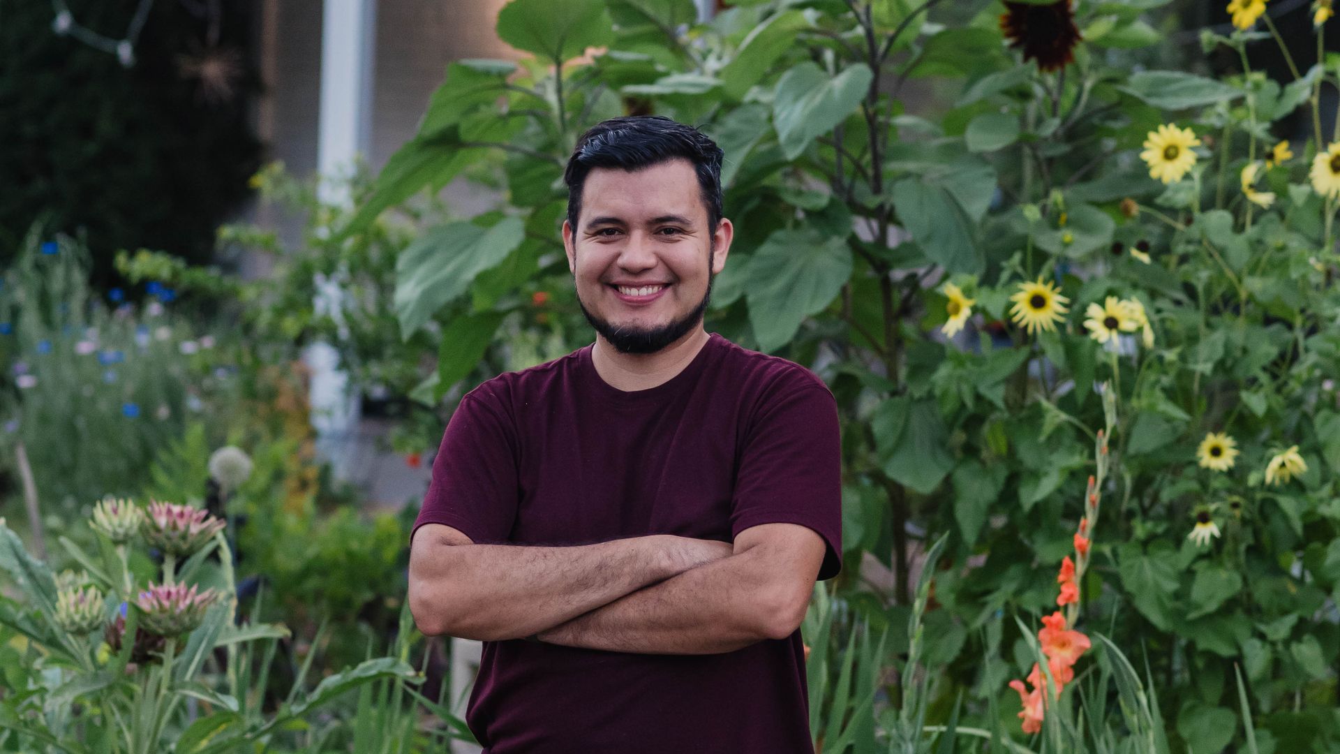 elias castillo the gardener standing in front of his plants