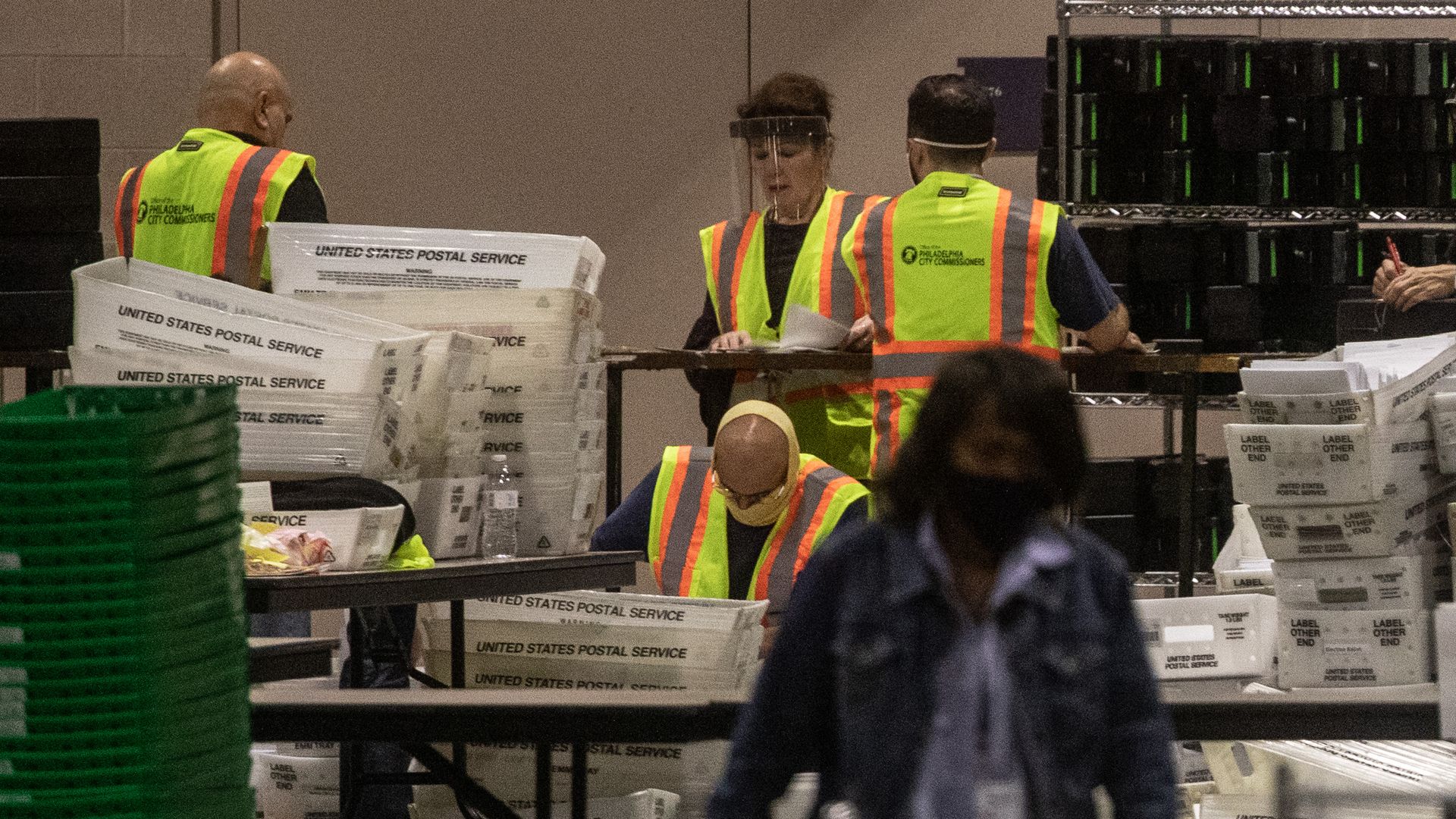 Election workers count ballots at the Philadelphia Convention Center on November 06, 2020 in Philadelphia, Pennsylvania.