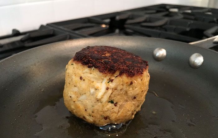 searing-crab-cake-from-clean-catch-charlotte