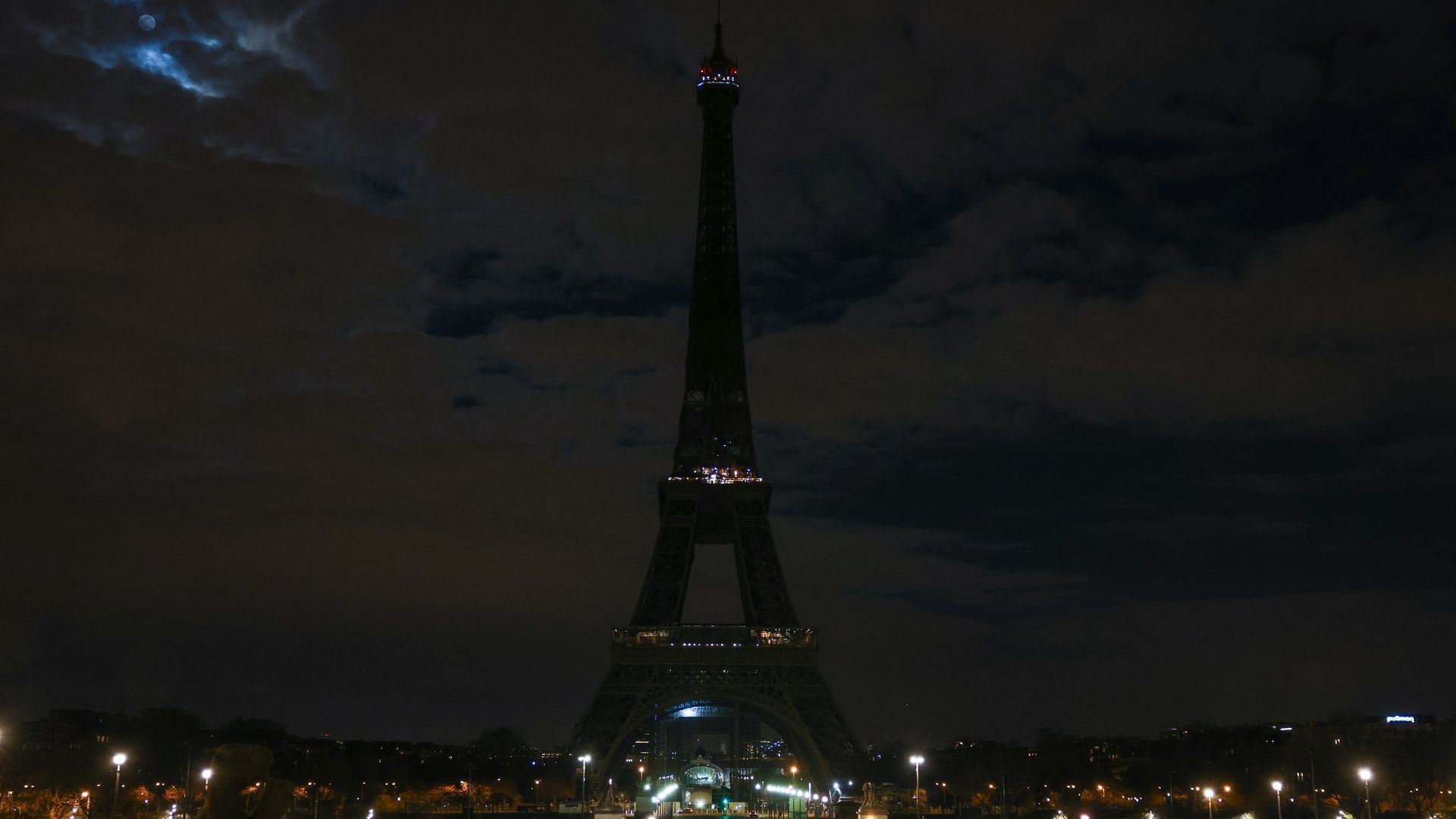 The Eiffel Tower submerges into darkness as part of the Earth Hour switch-off in Paris, France. 