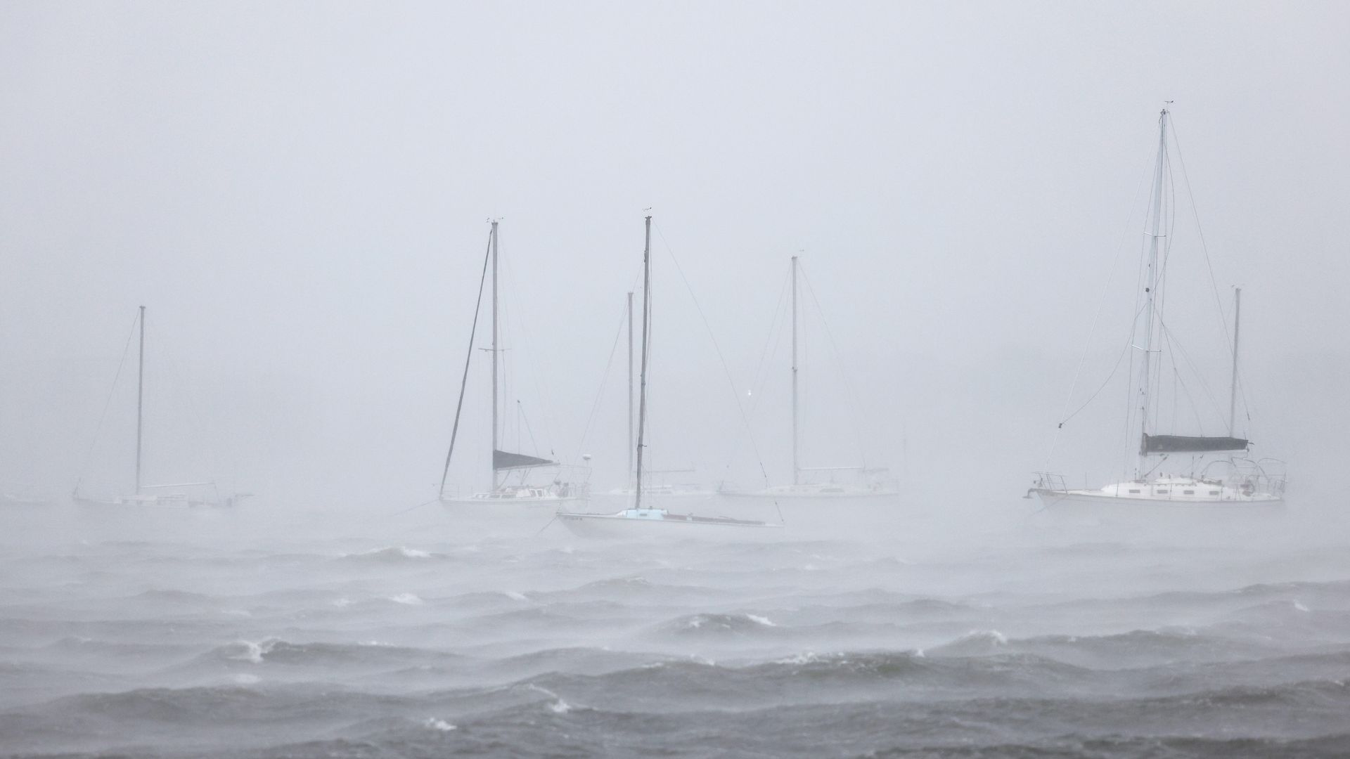 Docked boats on North Atlantic Ocean are seen as Tropical Storm Henri prepares to make landfall