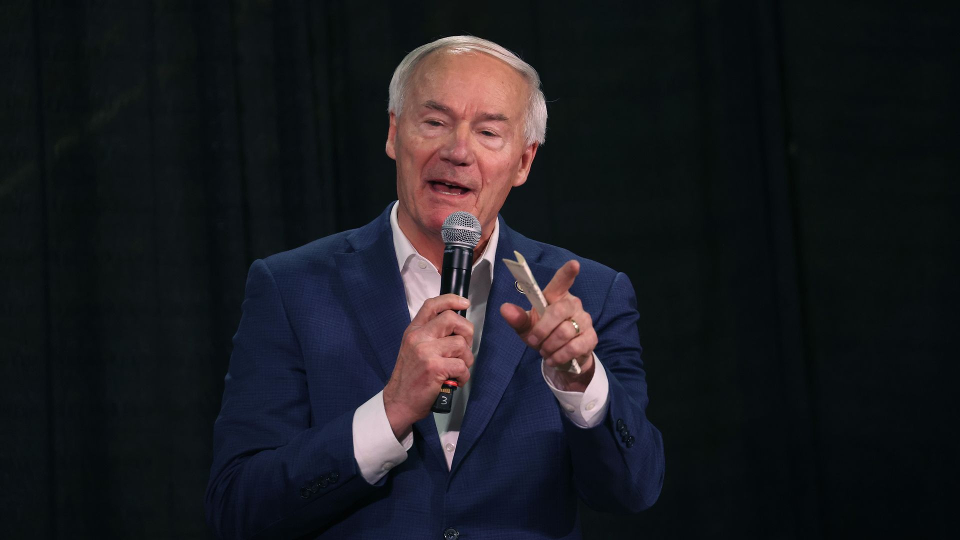 Republican presidential candidate former Arkansas Governor Asa Hutchinson speaks to guests at the third annual MMM Tailgate celebration hosted by U.S. Rep. Mariannette Miller-Meeks (R-IA) on October 20, 2023 in Iowa City, Iowa.