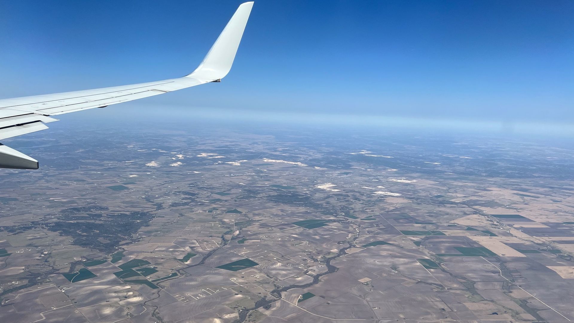 A photo of the view out an airplane window. 