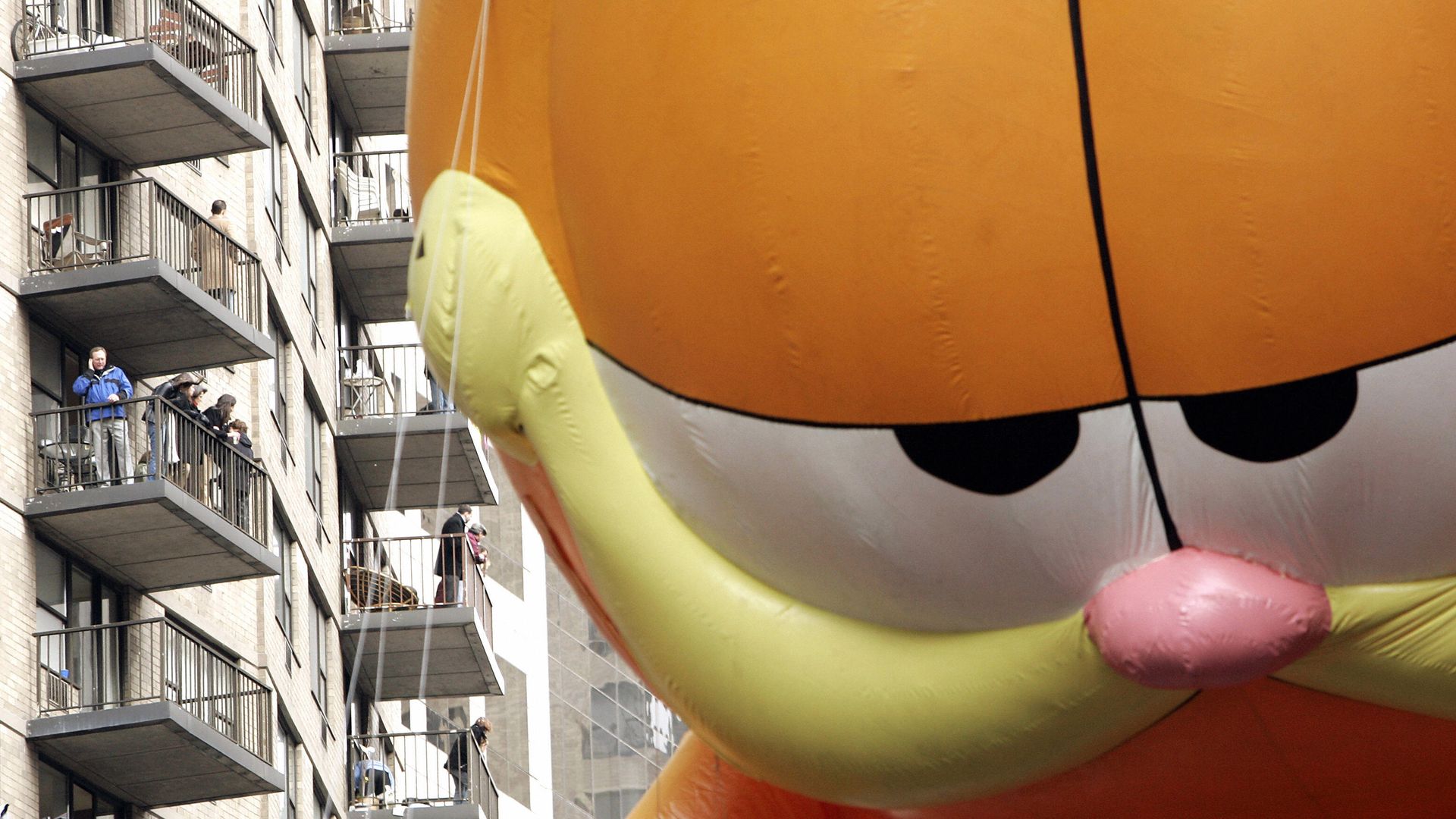 Photo of Garfield balloon floating in Macy's Thanksgiving Parade.