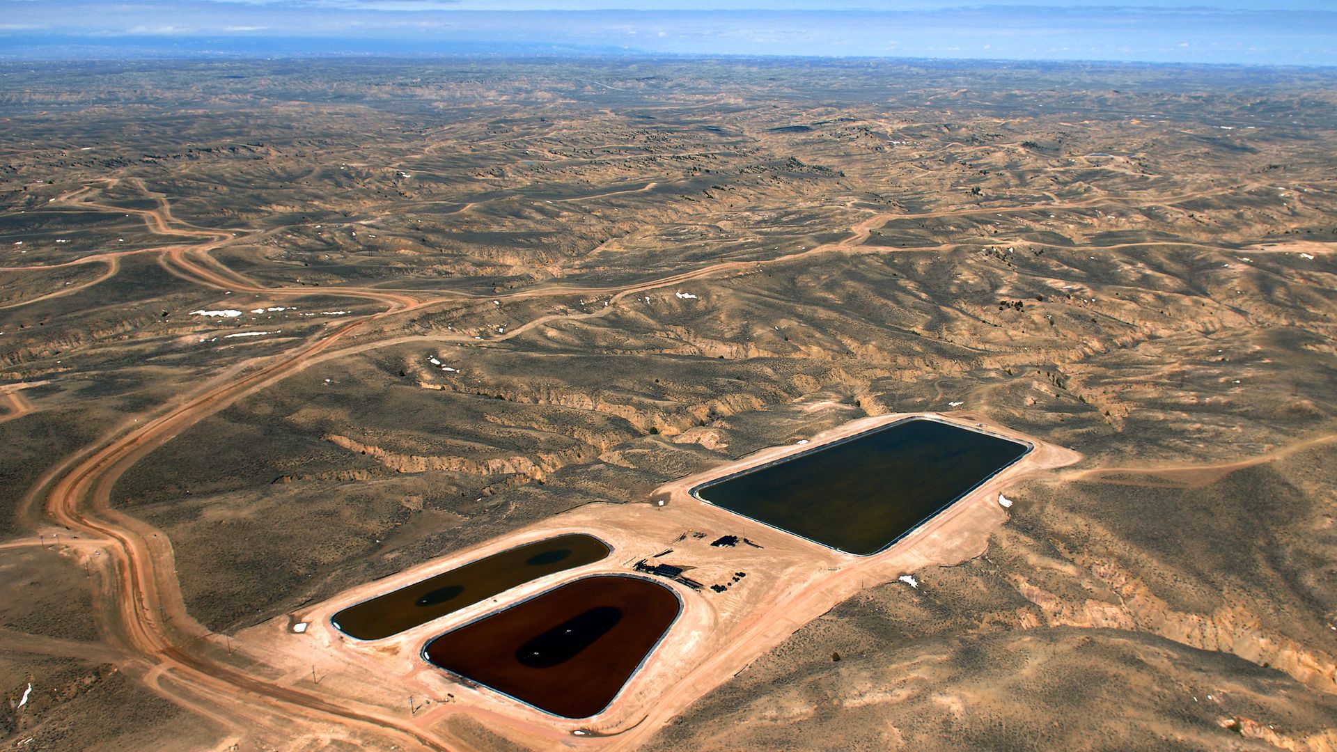 Ponds of coal bed methane water cover in the Powder River Basin  near Gillette, Wyoming, in 2007.