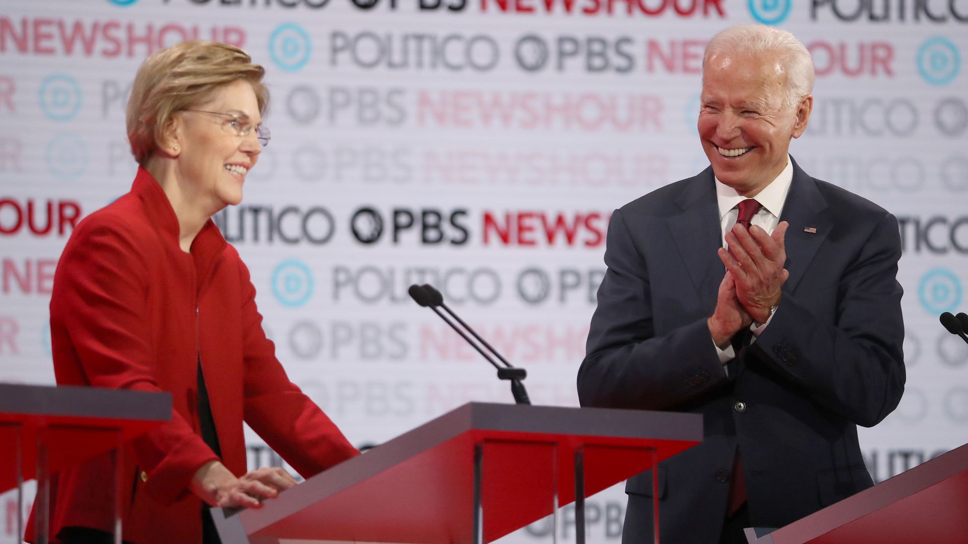 Joe Biden claps in the direction of Elizabeth Warren during a primary debate in December