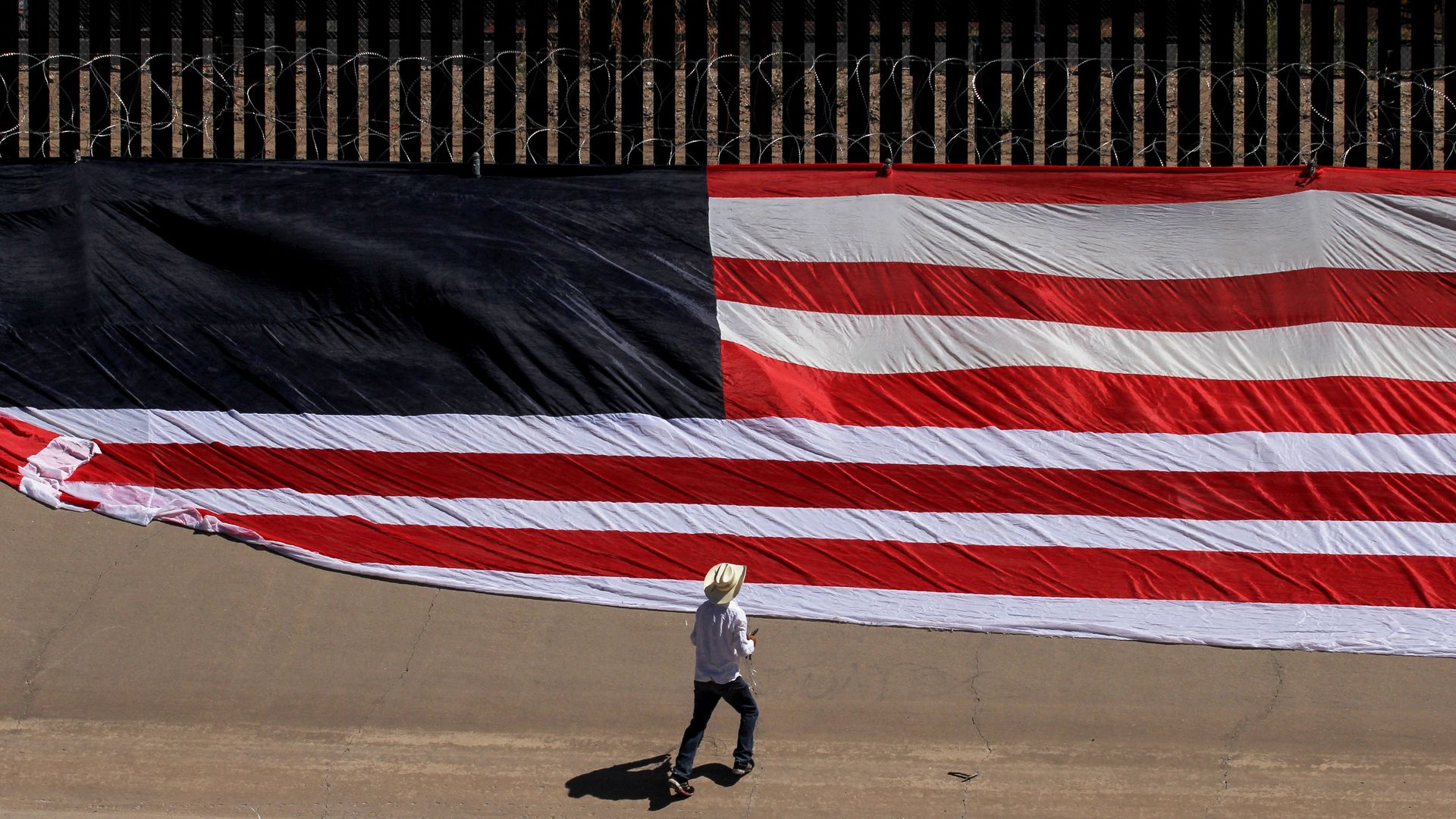 A United States national flag on the border wall next to Rio Grande river on June 6, 2019. 