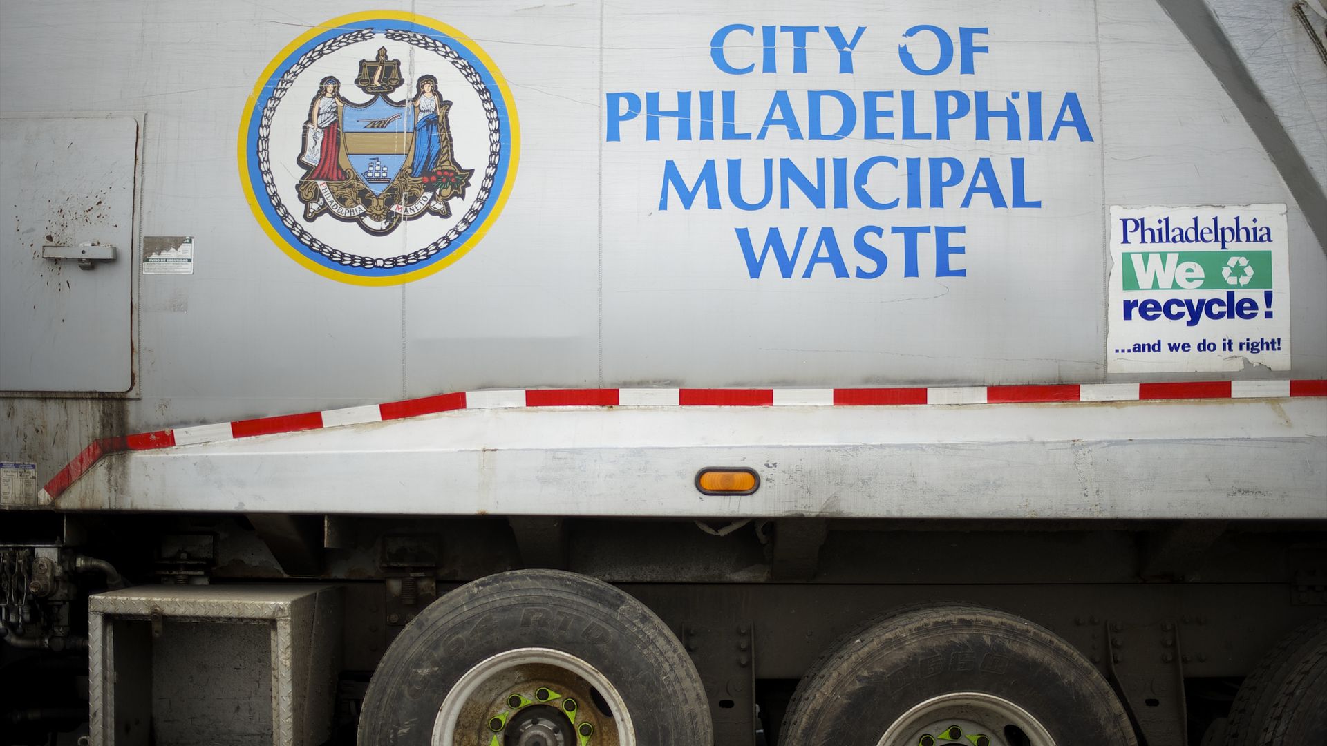 A garbage truck is parked beside hundreds of television sets and assorted electronics at Torresdsale Convenience Center in Philadelphia.