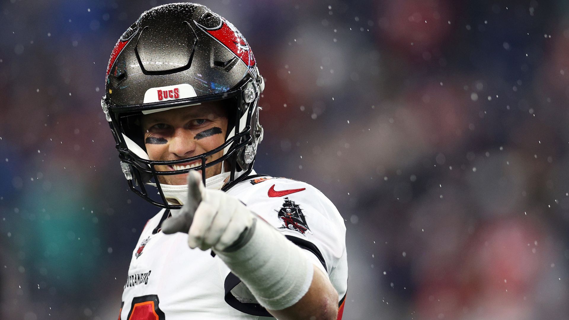 tom brady pointing at the camera and smiling