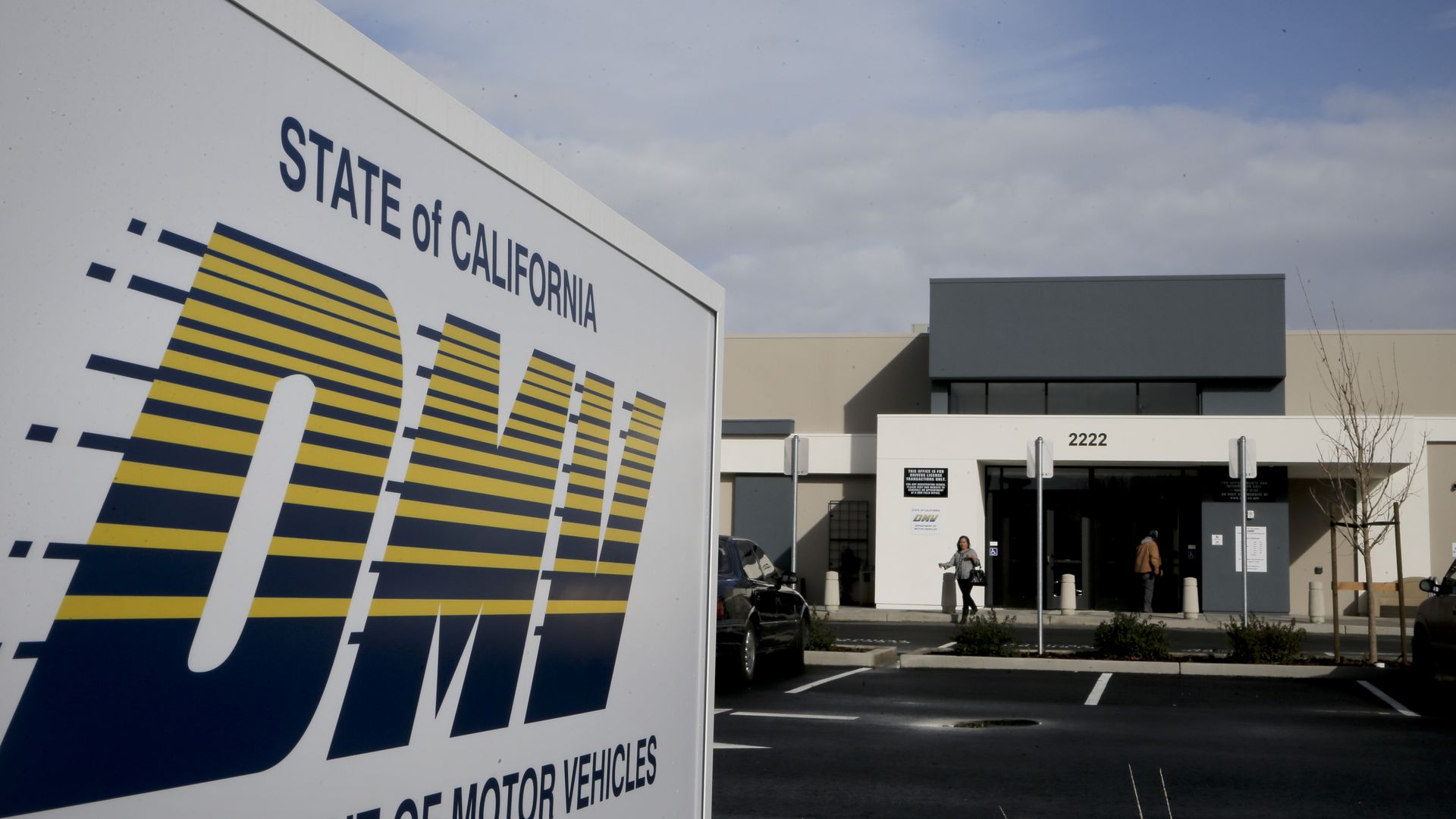 Photo of a truck with the "State of California DMV"  logo printed on the side
