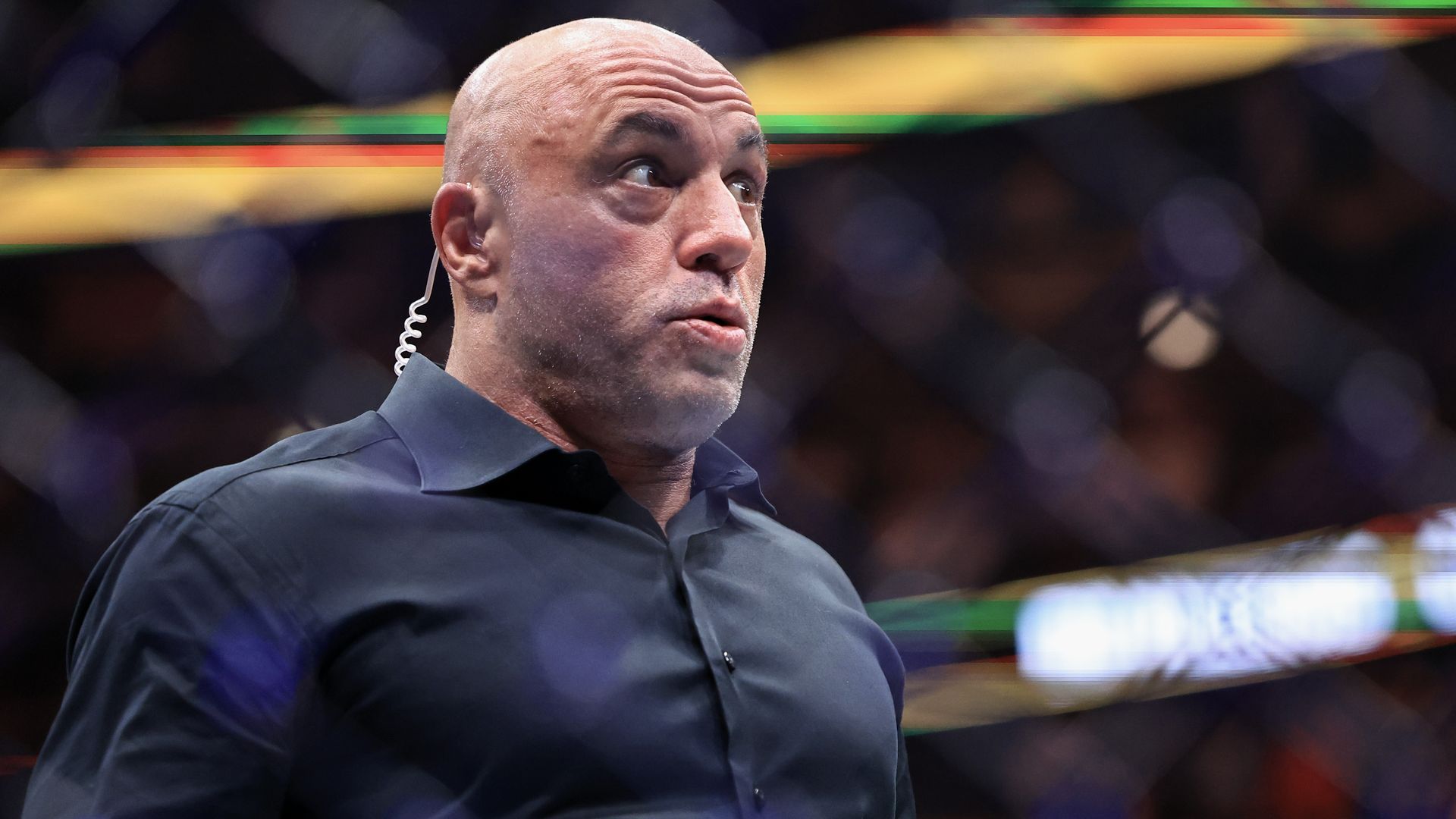 Joe Rogan reacts during UFC 319 at the United Center in Chicago.