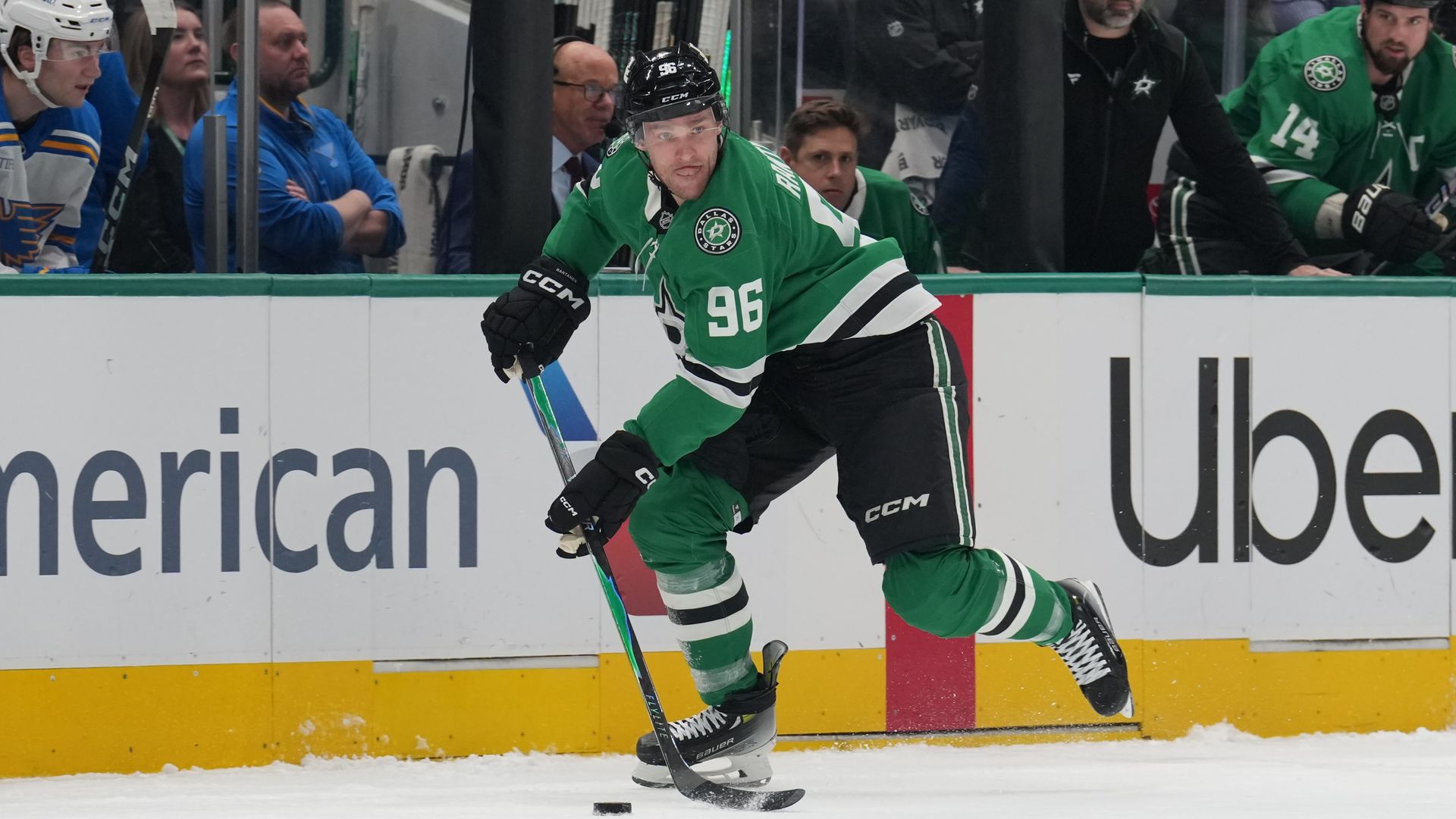 Mikko Rantanen wearing a No. 96 Dallas Stars jersey handles the puck.