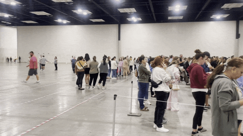 lines of people waiting for taylor swift merch