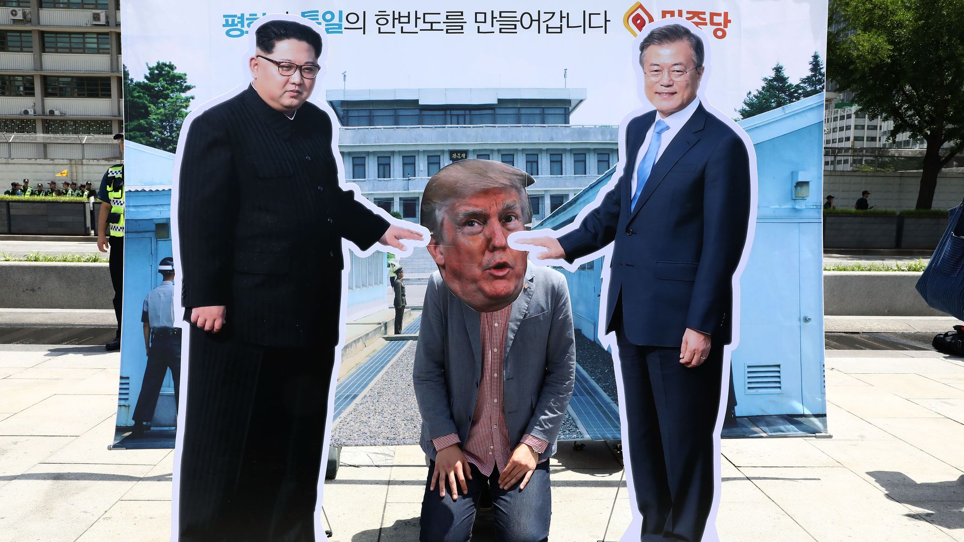 A South Korean protester wears a mask of U.S. President Donald Trump during a rally to demand a U.S. and North Korea summit on May 25, 2018 in Seoul, South Korea.