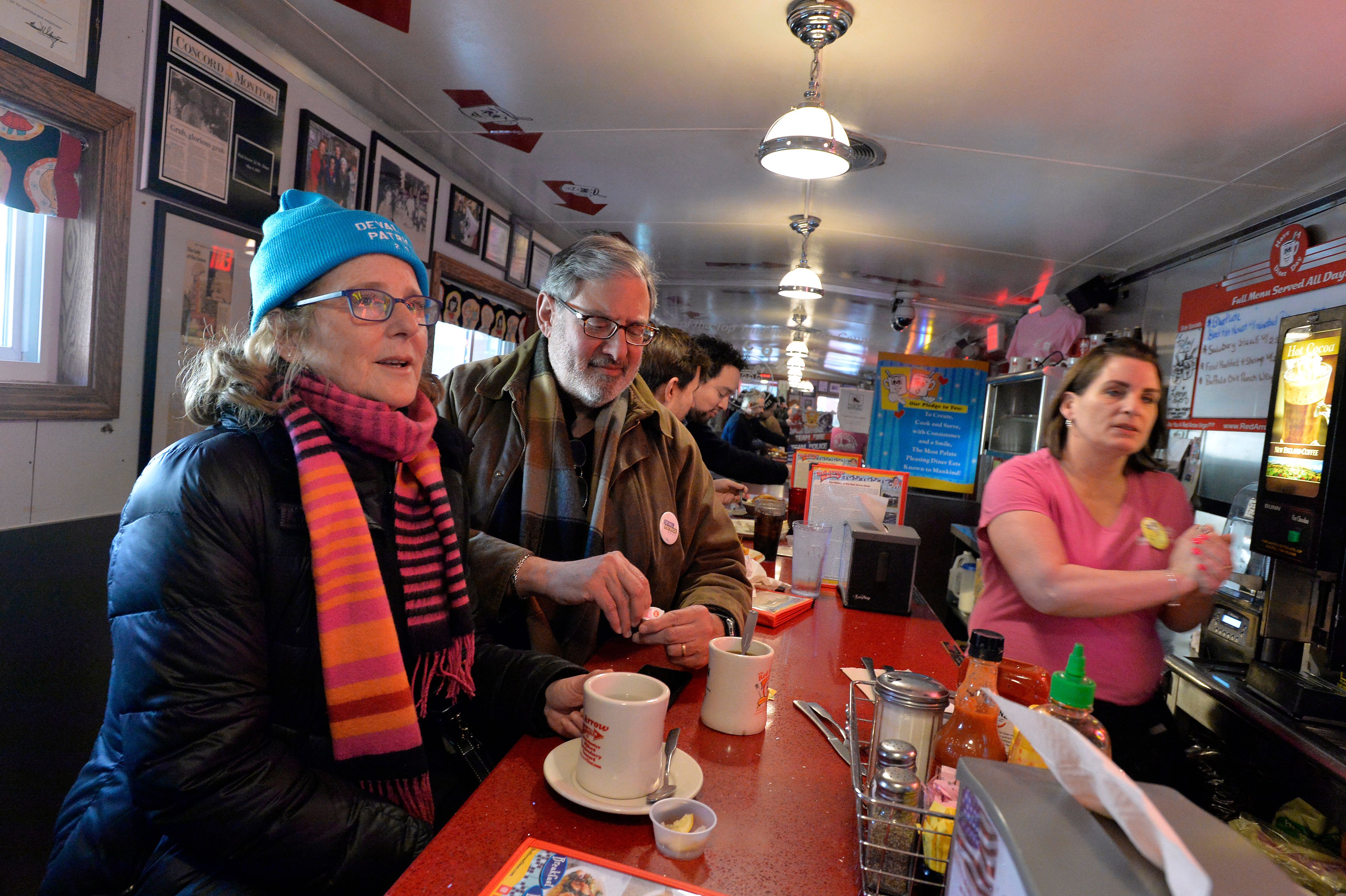 Supporters of Democratic presidential candidate Deval Patrick sit at the counter at the 24-hour restaurant the Red Arrow Diner in Manchester, New Hampshire 