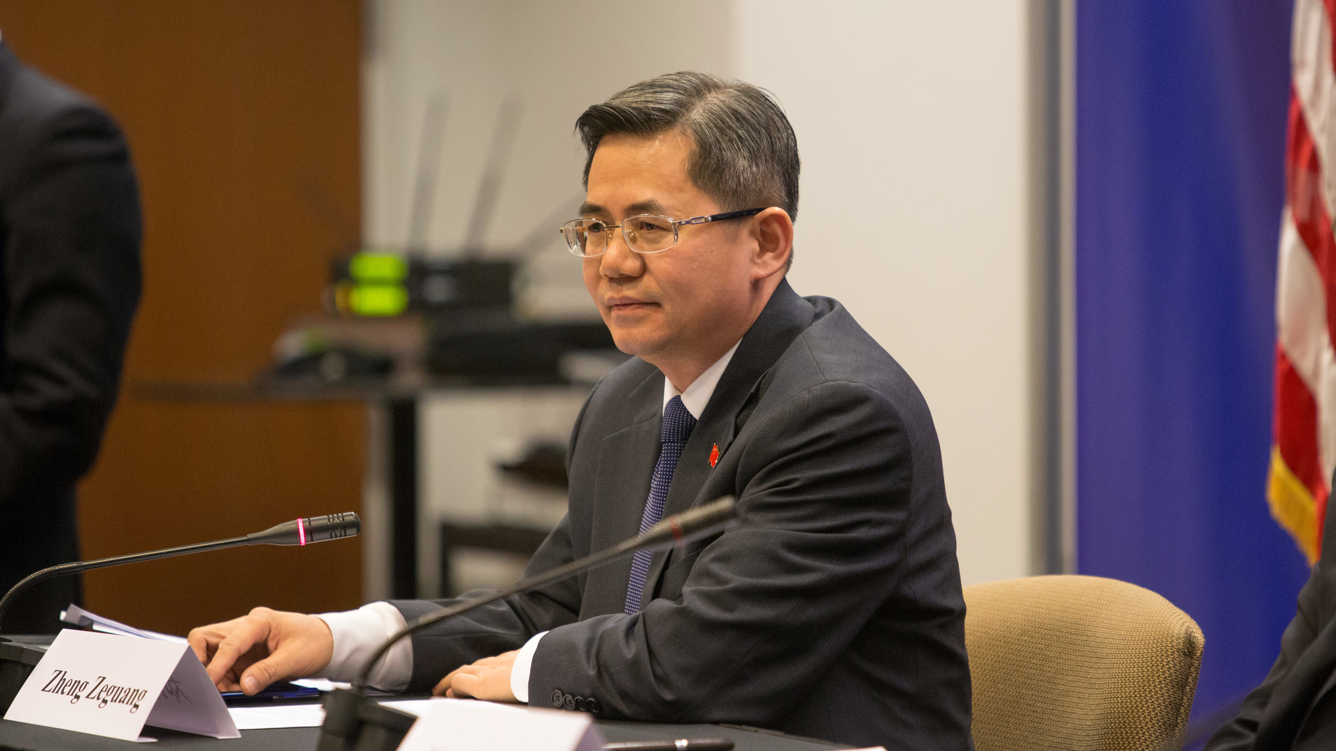 Zheng Zeguang speaking at a news conference in Chicago.