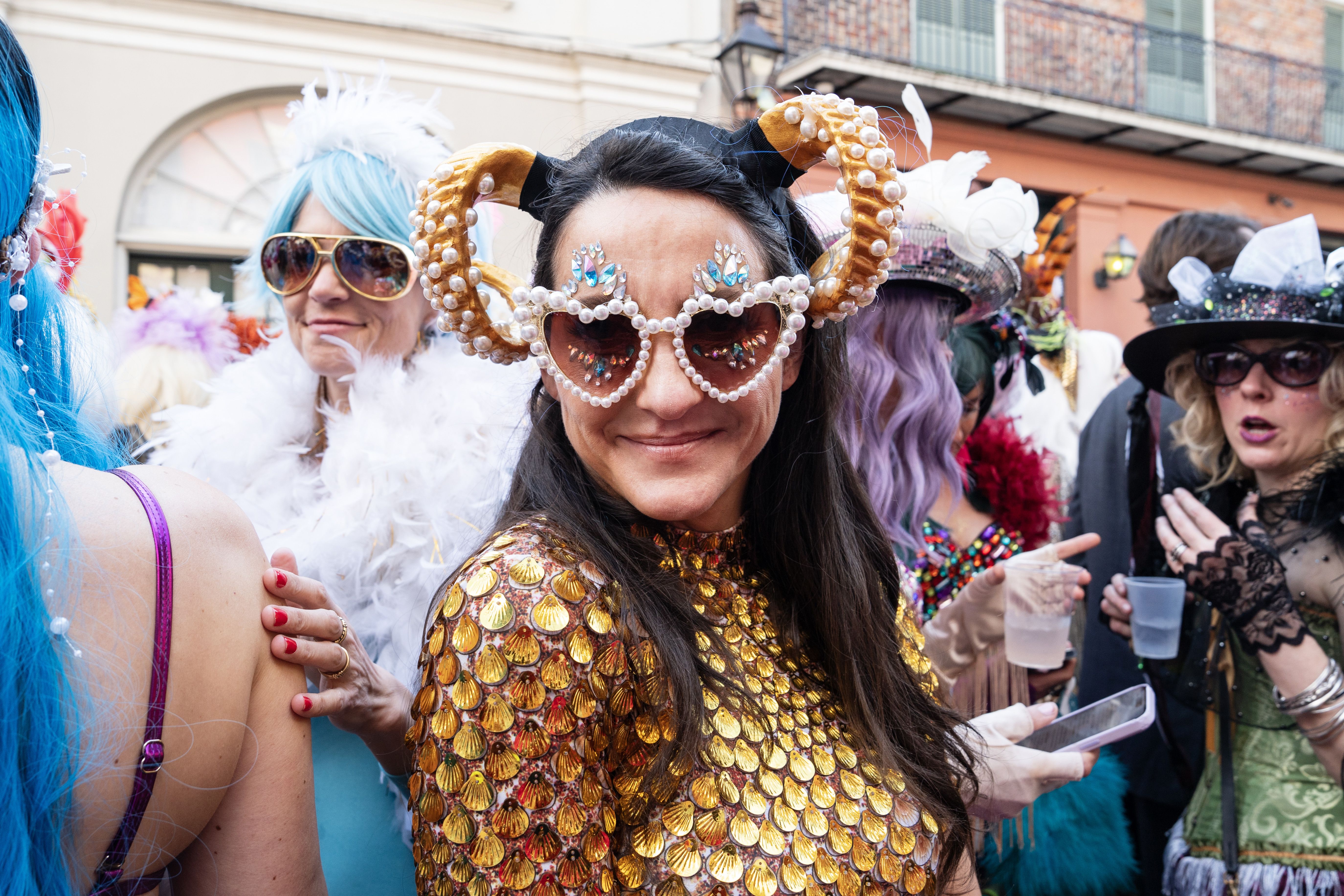 Photo shows a woman in a gold costume