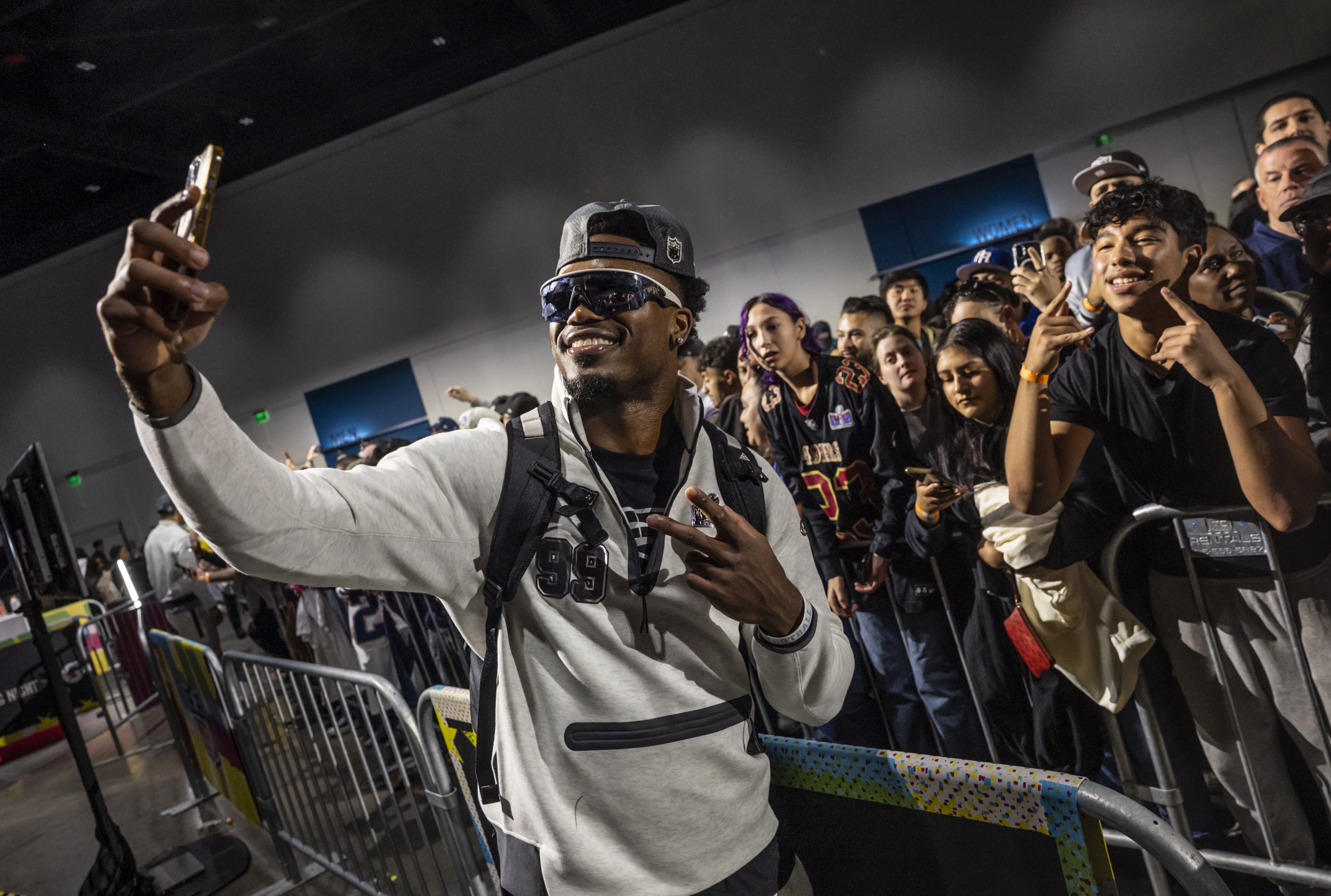 New England Patriots' Amari Gainer poses for a photo with fans during Super Bowl LX Opening Night at the San Jose Convention Center in San Jose, Calif., on Monday, Feb. 2, 2026. (Photo by Carlos Avila Gonzalez/San Francisco Chronicle via Getty Images)