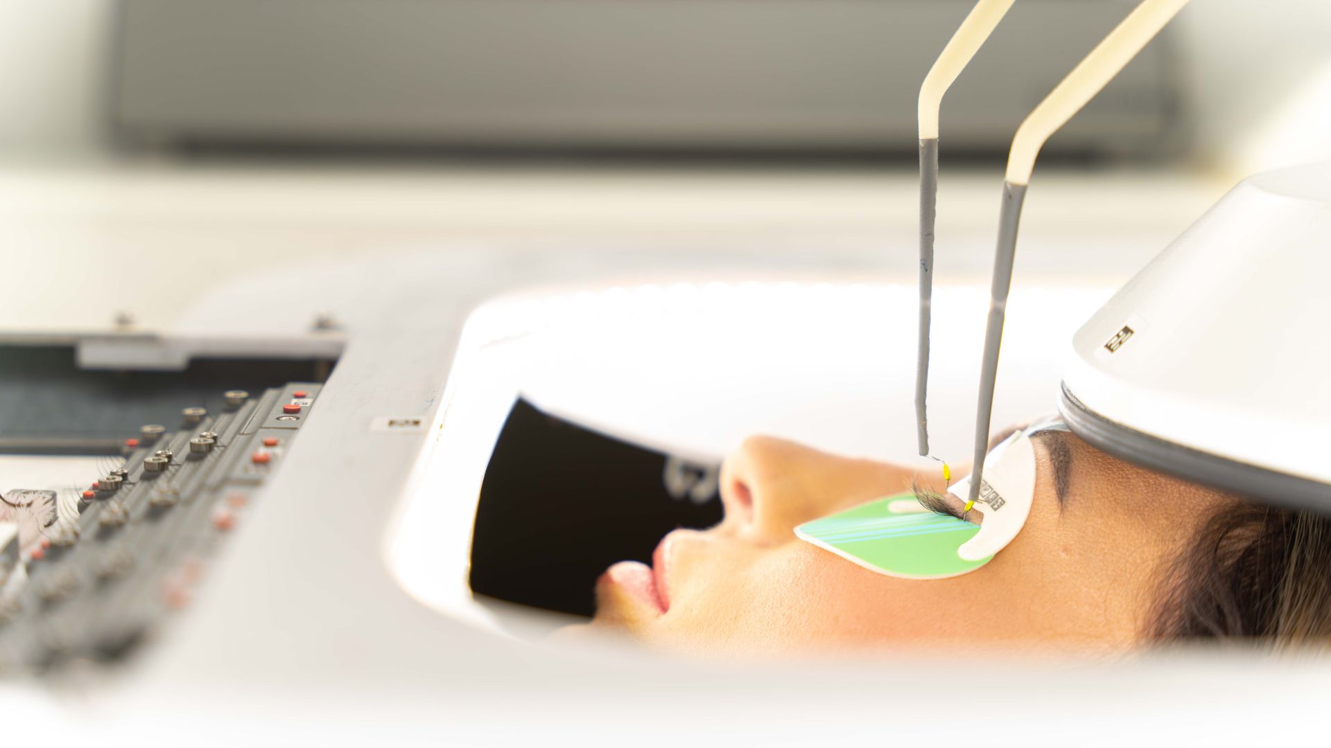 Luum's eyelash machine being used to apply eyelashes on a customer