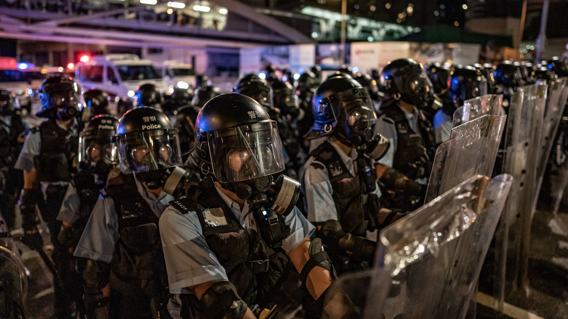 Thousands of pro-democracy protesters faced off with riot police on Monday during the 22nd anniversary of Hong Kong's return to Chinese rule as riot police officers u