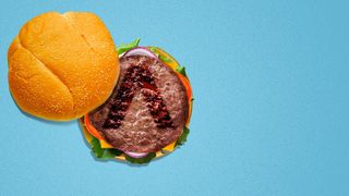 Illustration of a cheeseburger with the Axios "A" as a grillmark on the burger patty. 