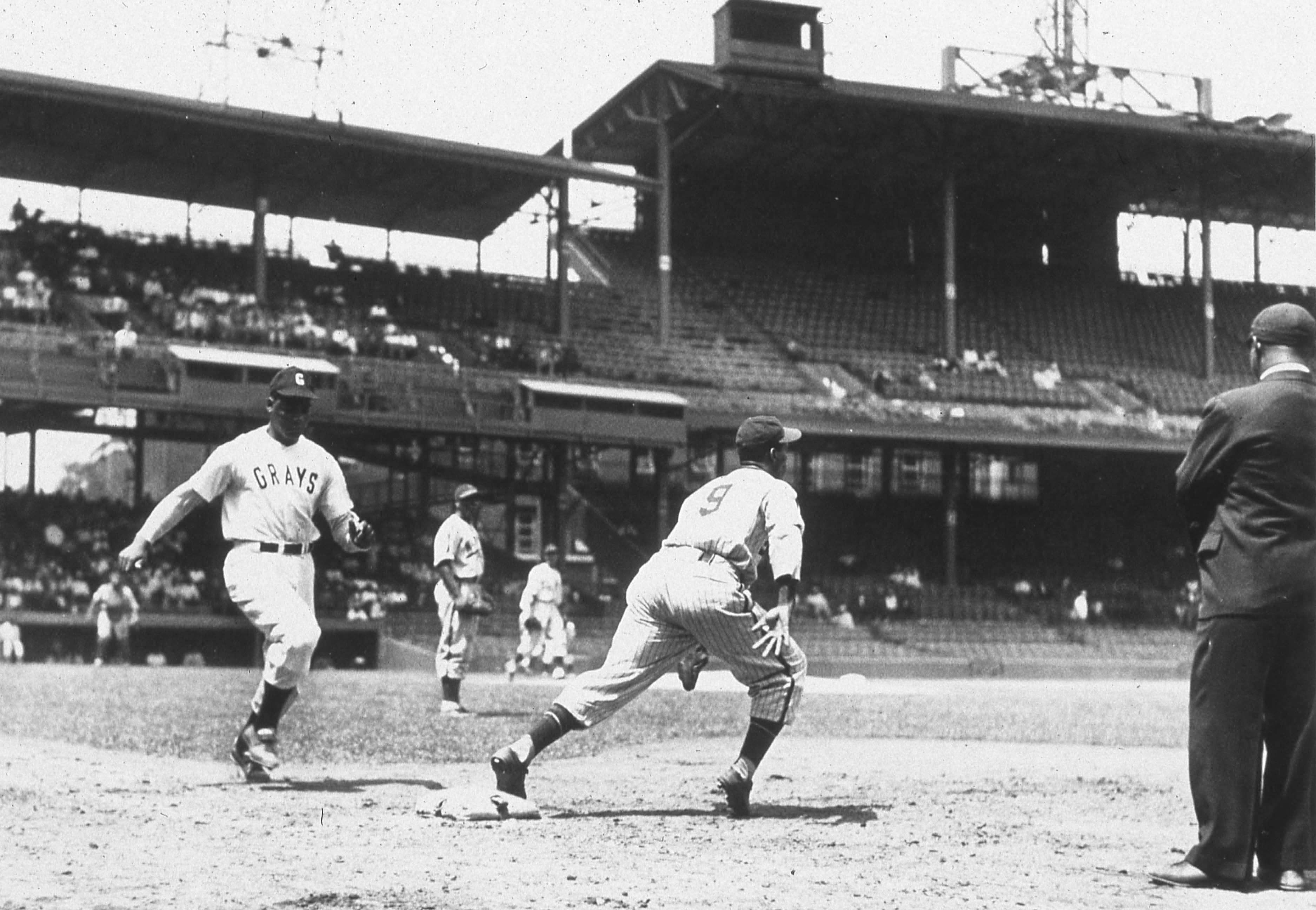 Josh Gibson, catcher for the Negro League Homestead Grays, is approaching first base as he runs out 