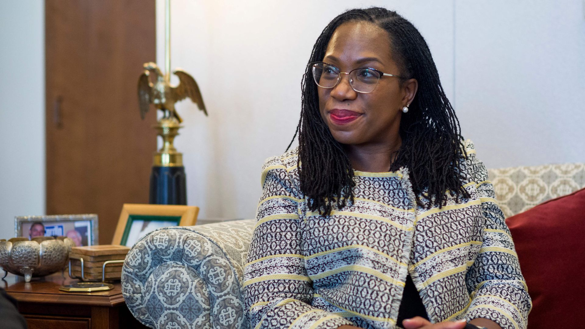 Photo of Ketanji Brown Jackson sitting with her hands folded in her lap